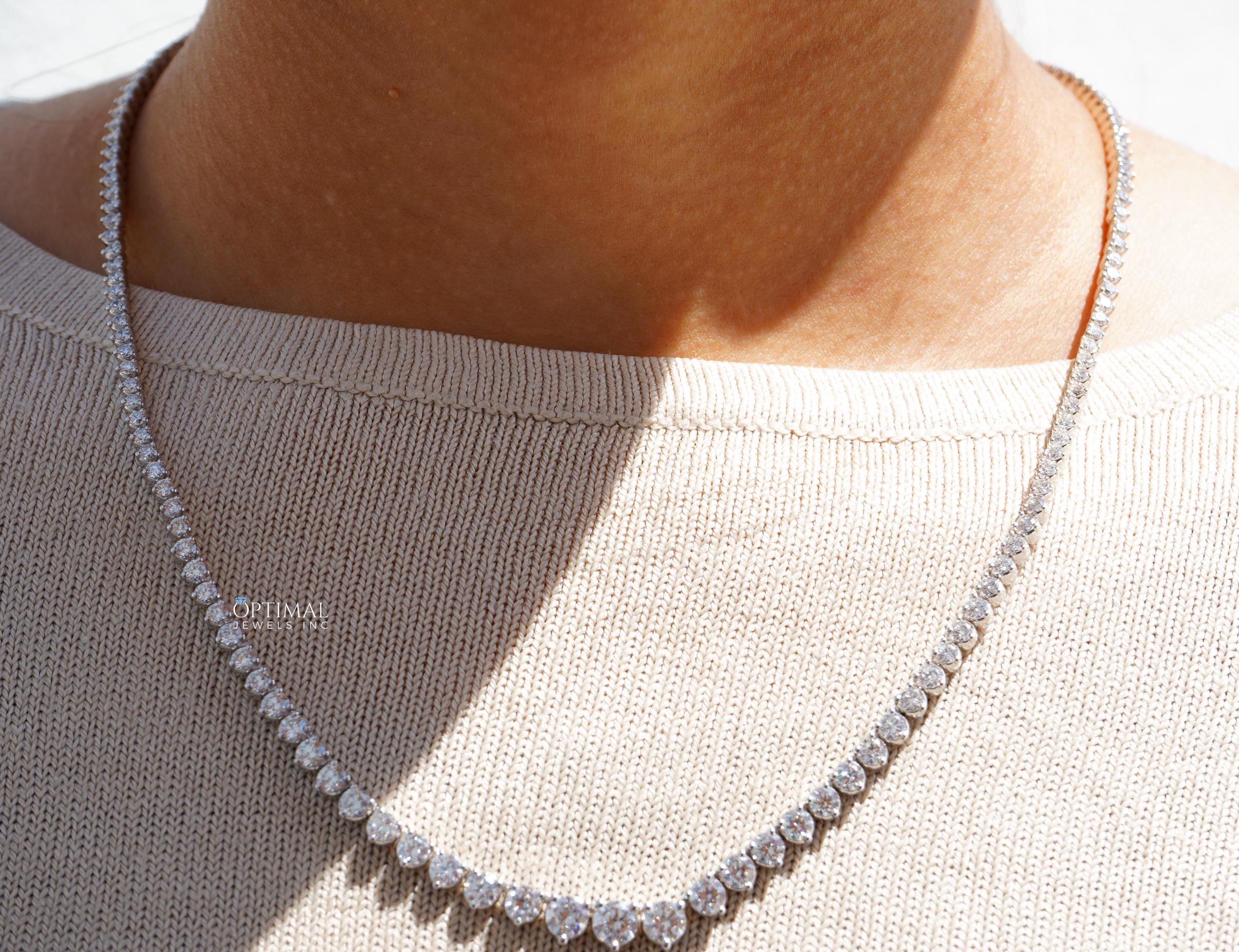 Gorgeous round lab grown diamond necklace featuring 20.50 CTW in an elegant tennis design, set in 18K white gold.