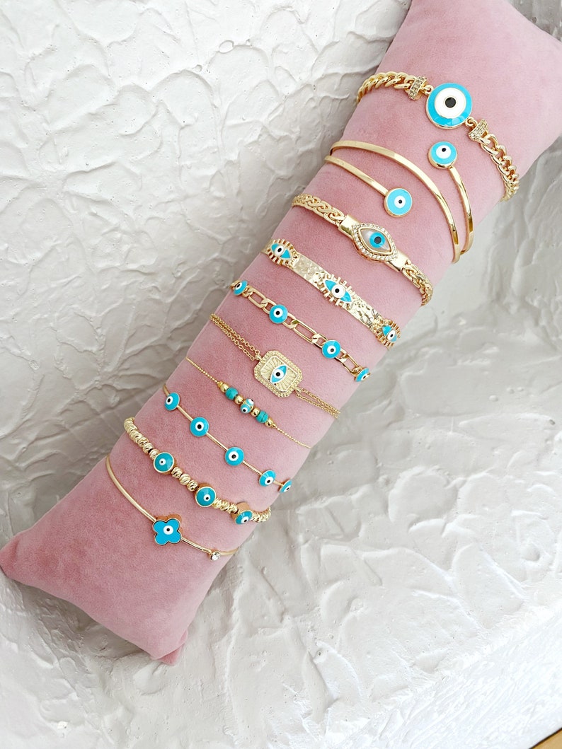 A beautiful Greek Evil Eye Bracelet featuring a blue evil eye charm on a delicate 14K gold chain, perfect for protection and style.
