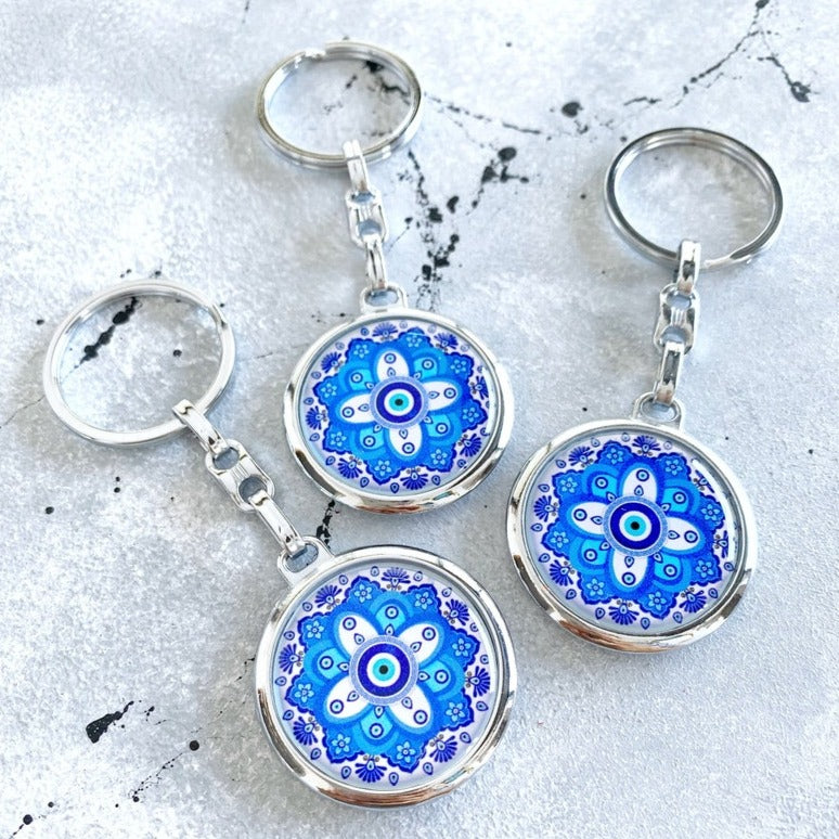 Handmade Greek Evil Eye Keyring featuring blue and white colors with a silver-plated finish, perfect for bags or car charms.