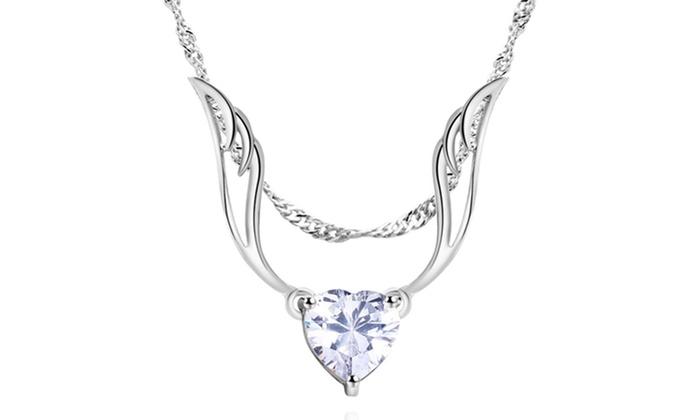 A beautiful Guardian Angel Wing Necklace featuring a white gold plated chain and sparkling crystal accents, showcasing an elegant angel wing pendant.