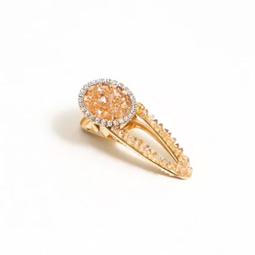 A luxurious Hailie Barrette hair clip with sparkling accents, perfect for adding elegance to any hairstyle.