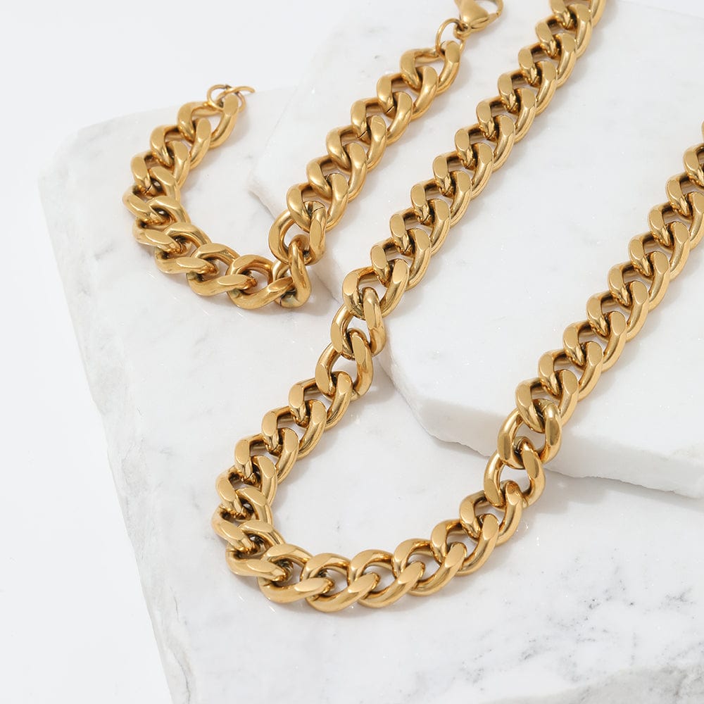 Haja Chunky Cuban Chain Necklace and Bracelet in Gold, showcasing a luxurious stainless steel curb chain design with 18K gold PVD plating.