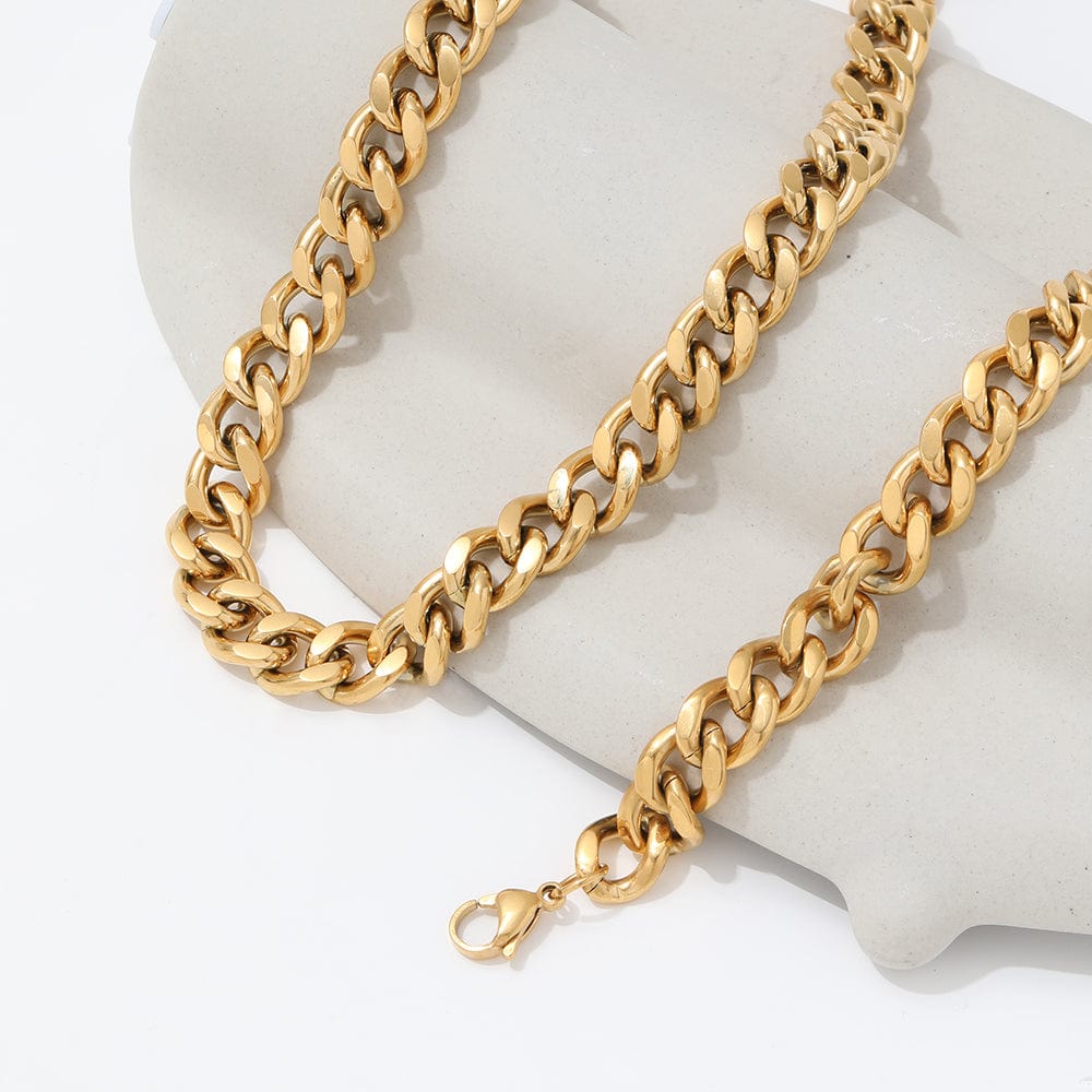 Haja Chunky Cuban Chain Necklace and Bracelet in Gold, showcasing a luxurious stainless steel curb chain design with 18K gold PVD plating.