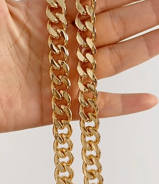 Haja Chunky Cuban Chain Necklace and Bracelet in Gold, showcasing a luxurious stainless steel curb chain design with 18K gold PVD plating.