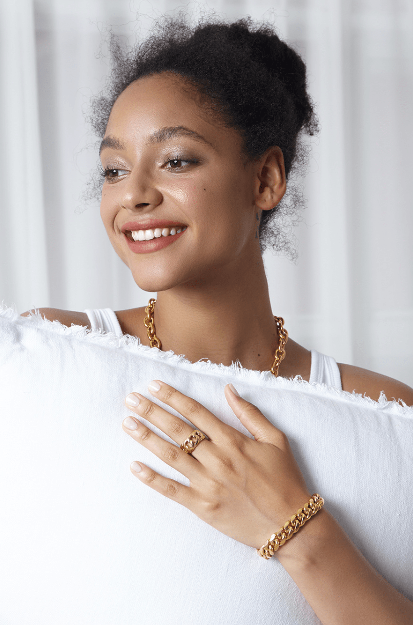 Haja Chunky Cuban Chain Necklace and Bracelet in Gold, showcasing a luxurious stainless steel curb chain design with 18K gold PVD plating.