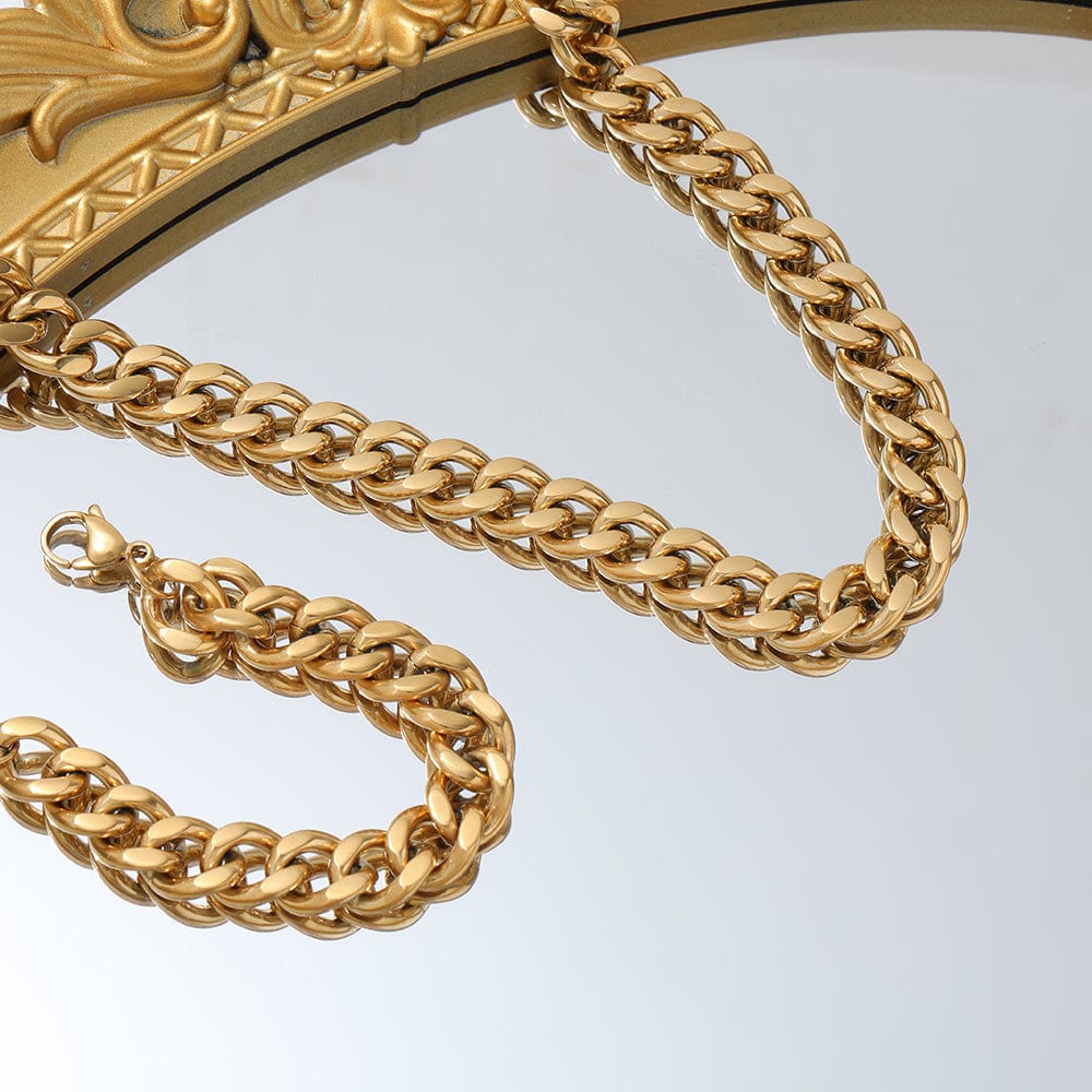 Haja Chunky Cuban Chain Necklace and Bracelet in Gold, showcasing a luxurious stainless steel curb chain design with 18K gold PVD plating.
