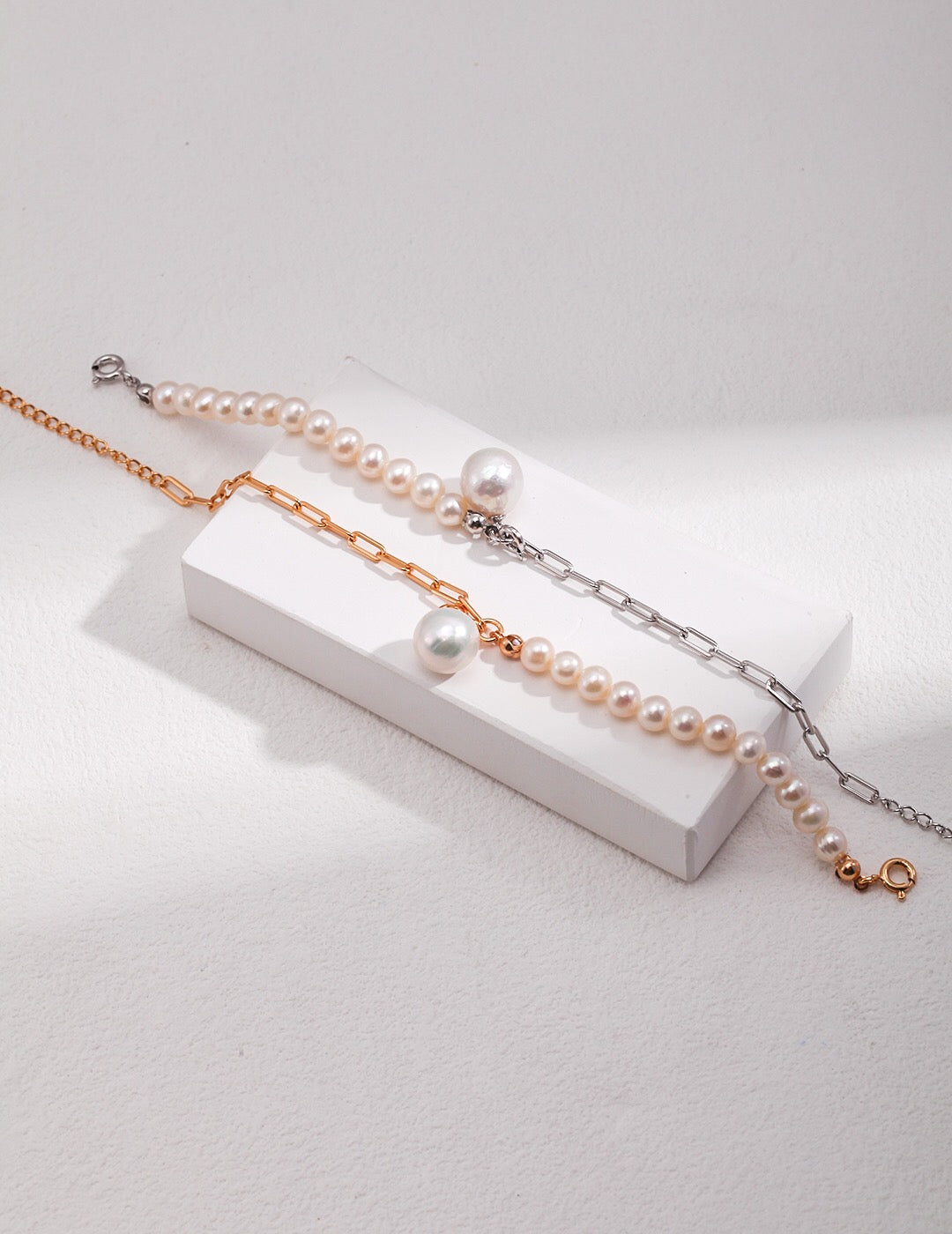 Half Chain Half Pearl Pendant Bracelet featuring natural pearls and sterling silver, elegantly designed for a sophisticated look.