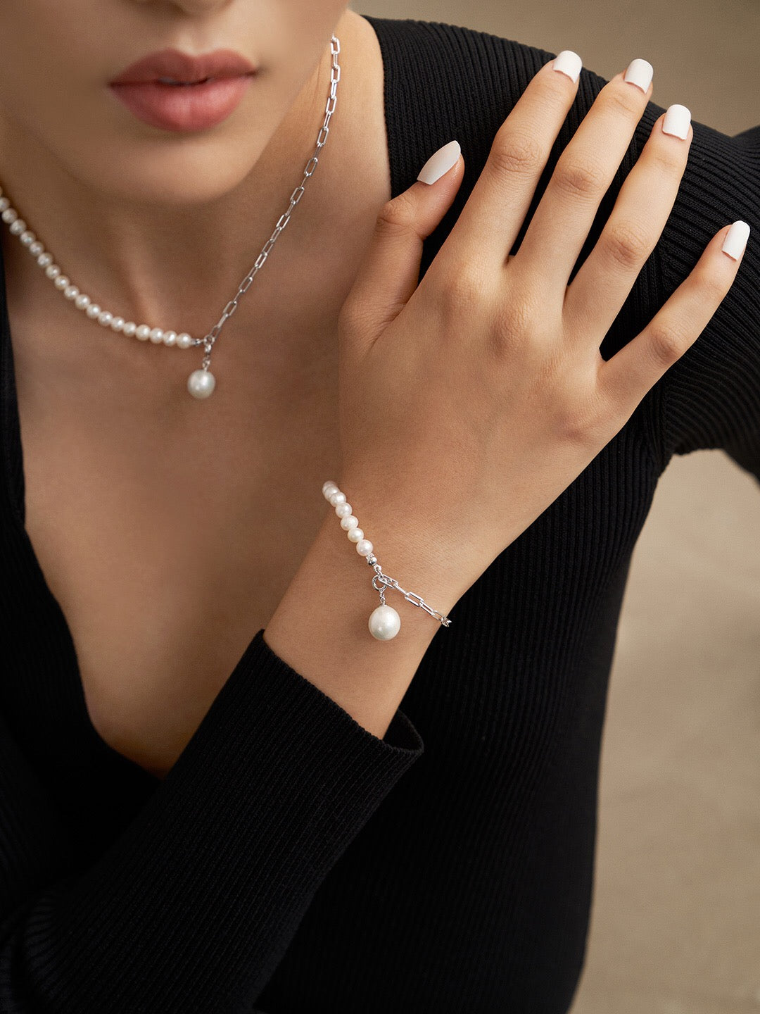 Half Chain Half Pearl Pendant Bracelet featuring natural pearls and sterling silver, elegantly designed for a sophisticated look.