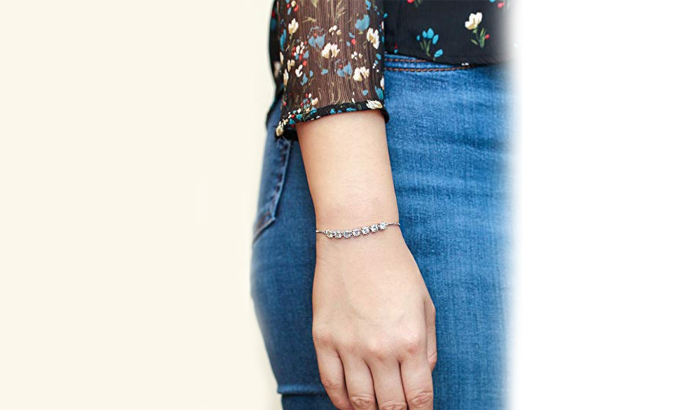 Elegant Halo Stud Earring and Adjustable Tennis Bracelet set, featuring Austrian crystals and 18K gold plating, displayed in a luxurious gift box.