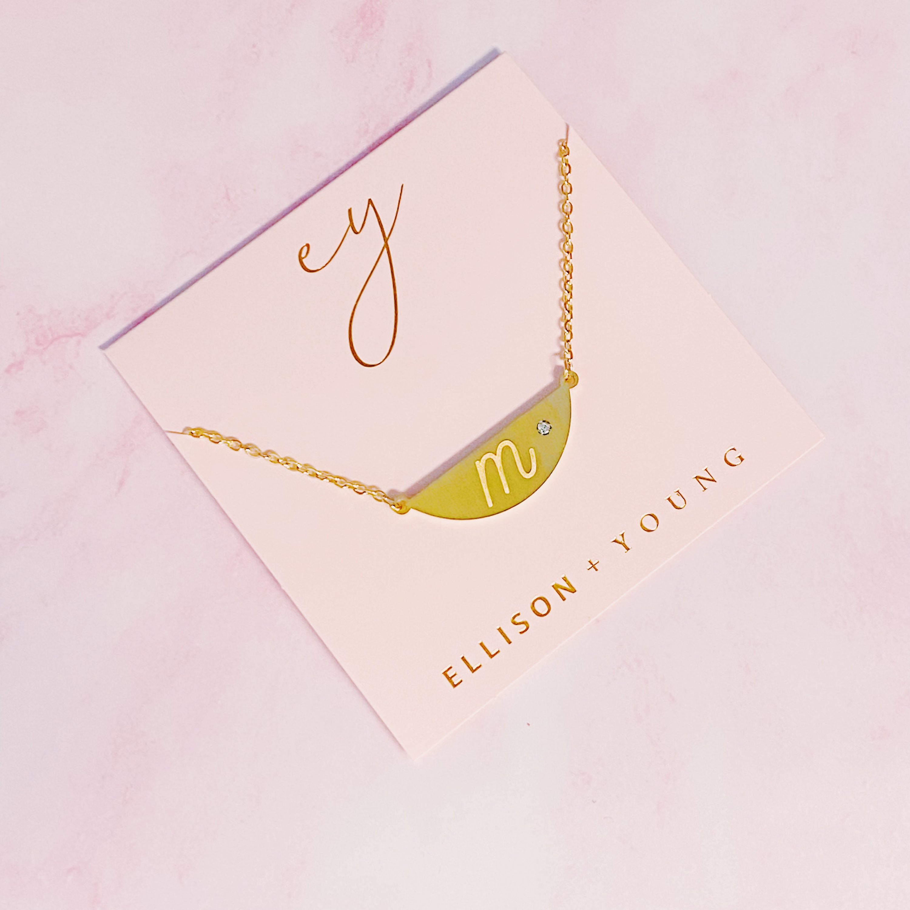 Hamilton Sphere Initial Necklace featuring a modern pendant design with an engraved initial and a brushed finish.