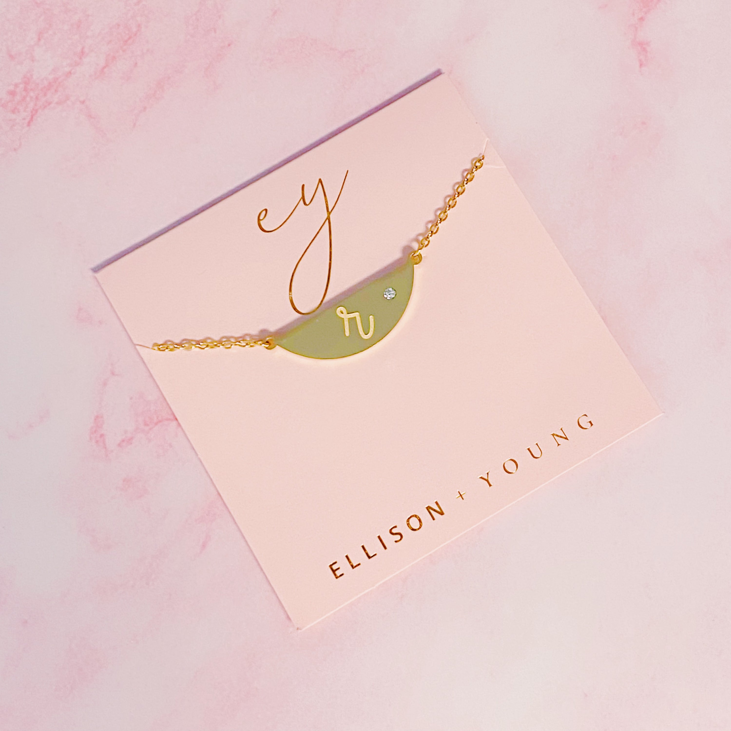 Hamilton Sphere Initial Necklace featuring a modern pendant design with an engraved initial and a brushed finish.