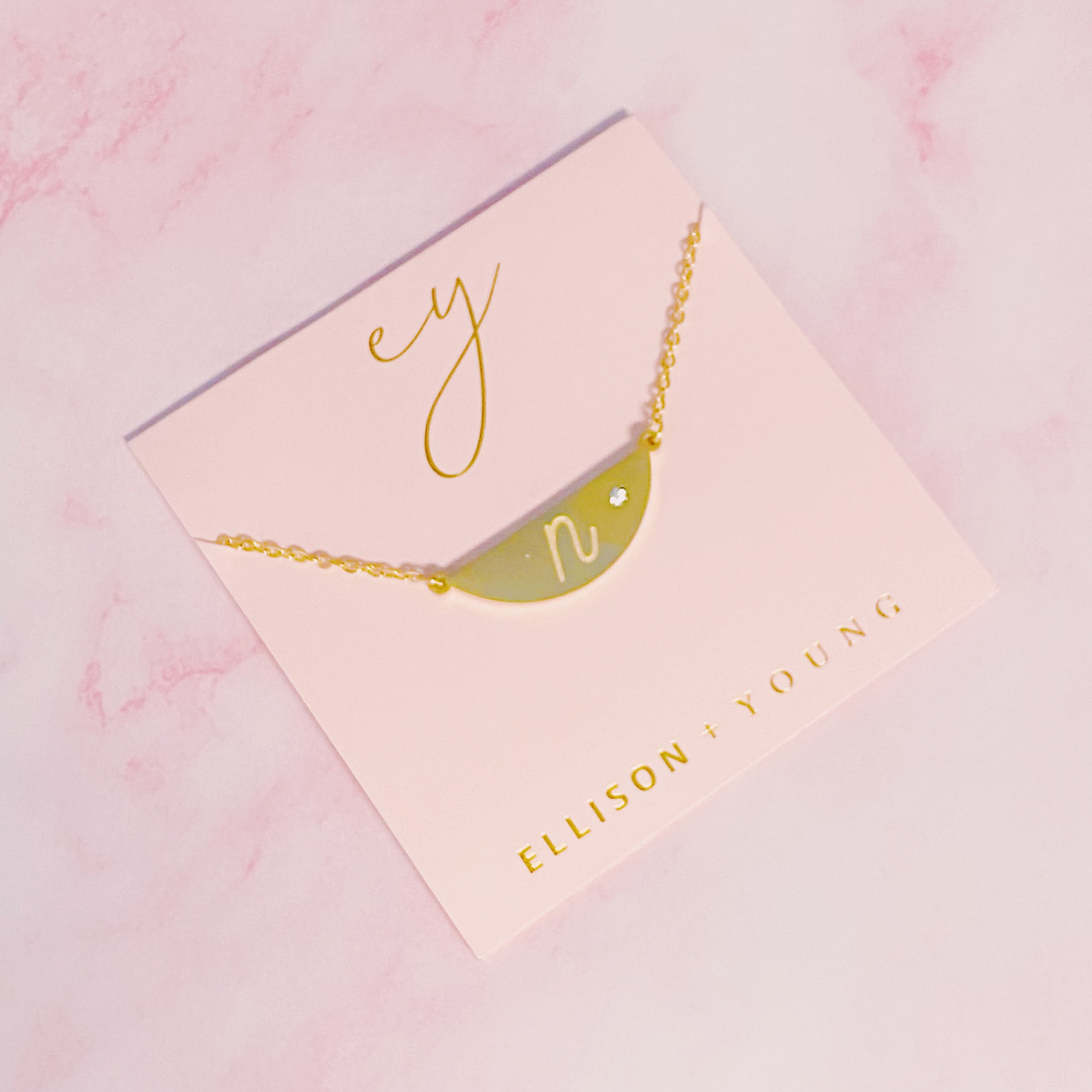 Hamilton Sphere Initial Necklace featuring a modern pendant design with an engraved initial and a brushed finish.