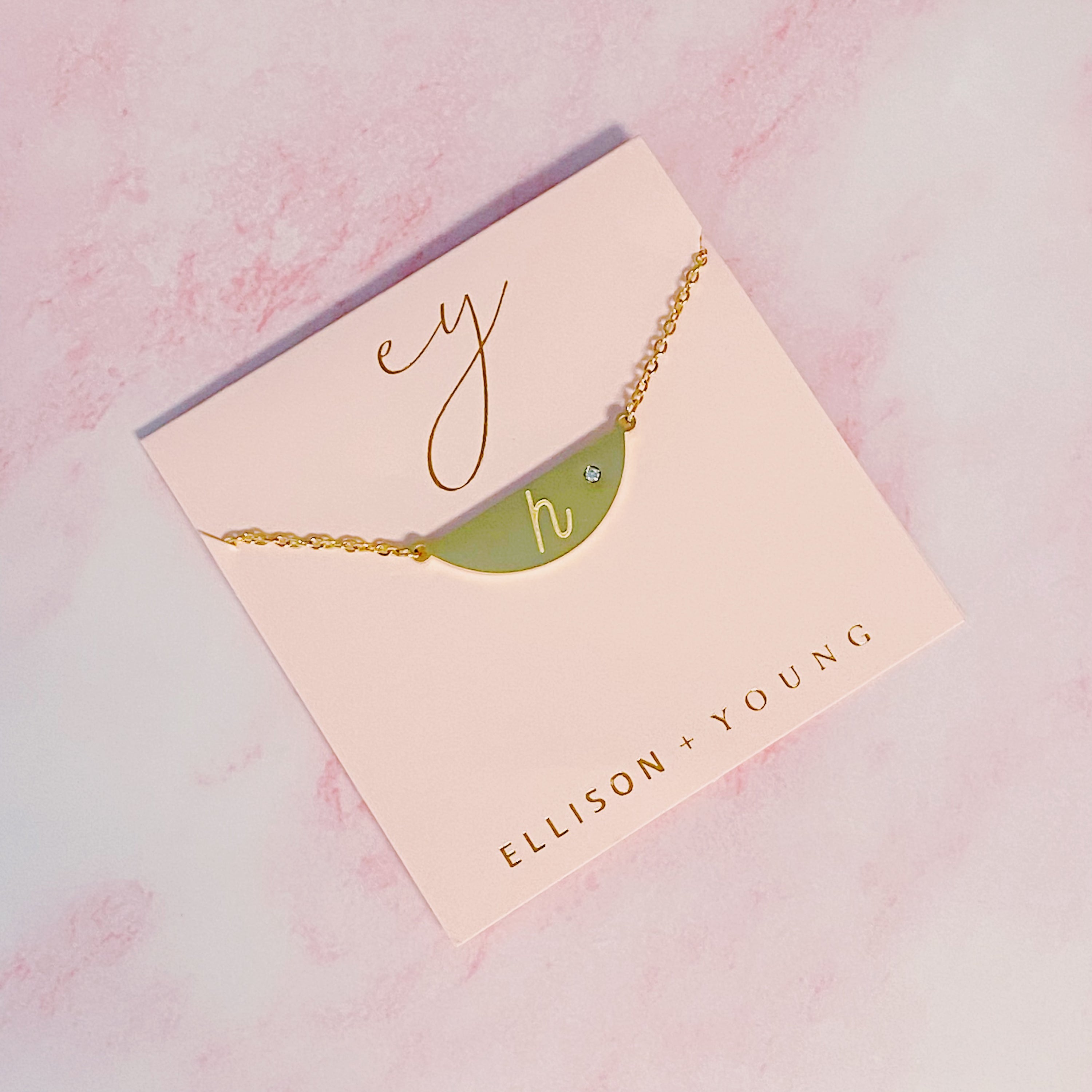 Hamilton Sphere Initial Necklace featuring a modern pendant design with an engraved initial and a brushed finish.