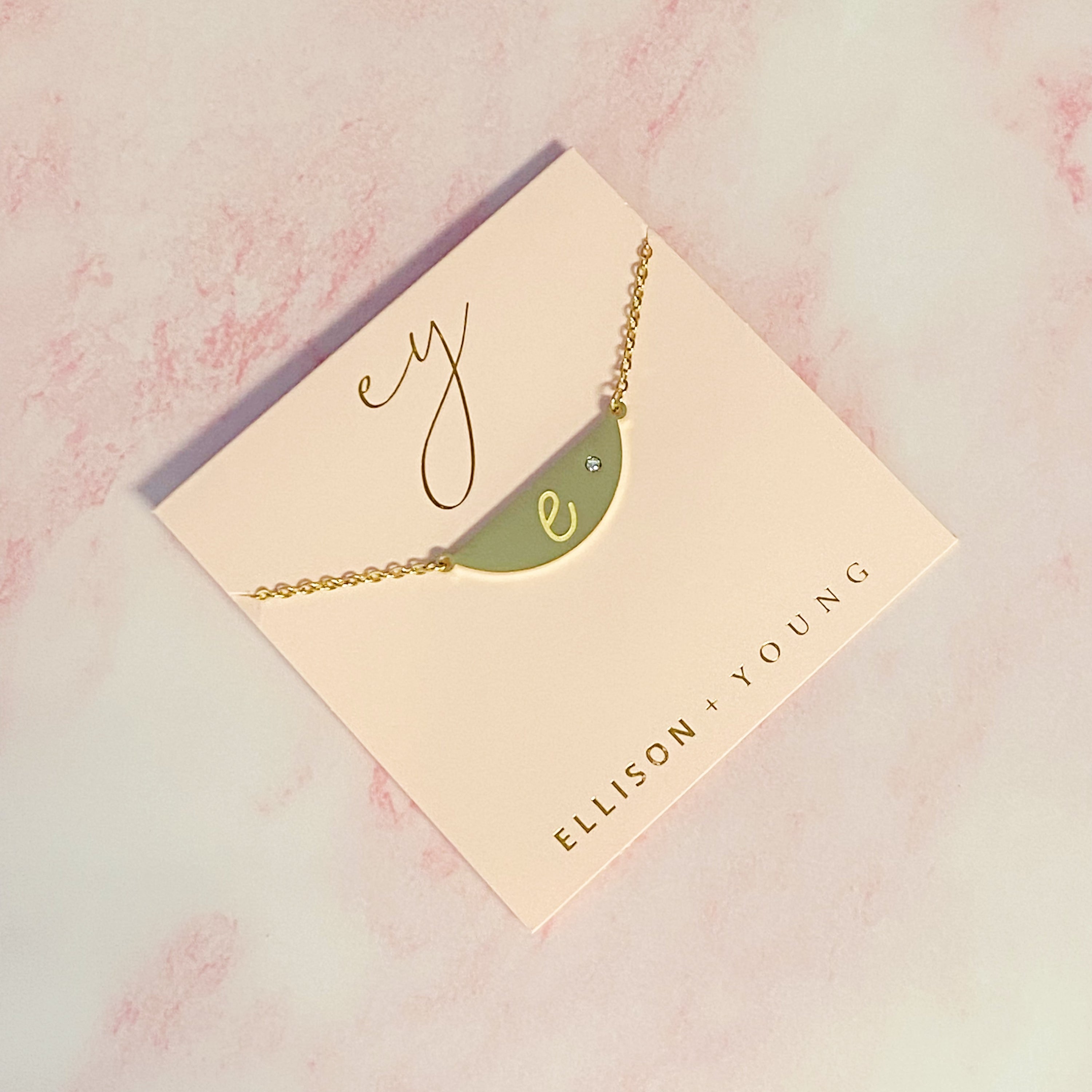 Hamilton Sphere Initial Necklace featuring a modern pendant design with an engraved initial and a brushed finish.