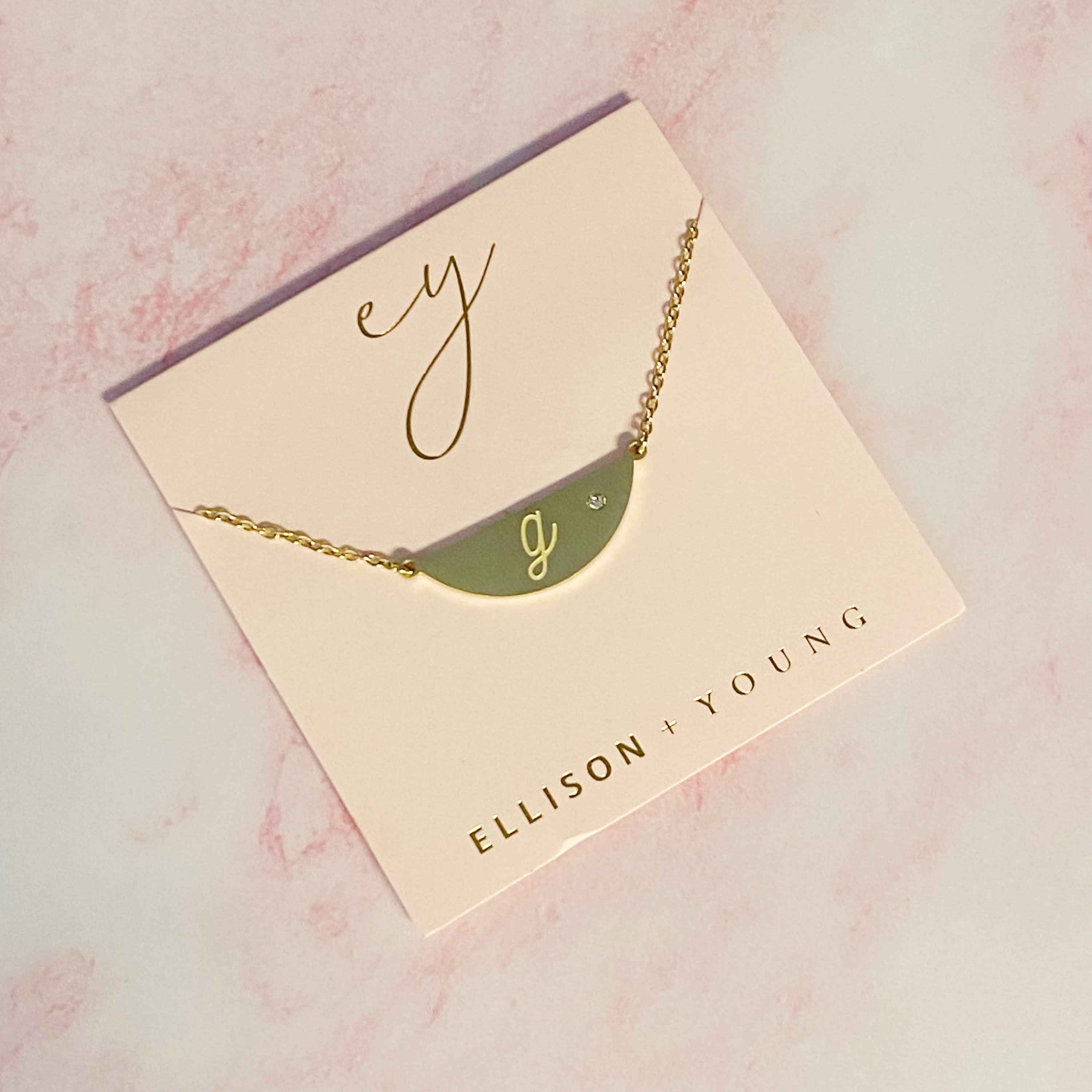 Hamilton Sphere Initial Necklace featuring a modern pendant design with an engraved initial and a brushed finish.