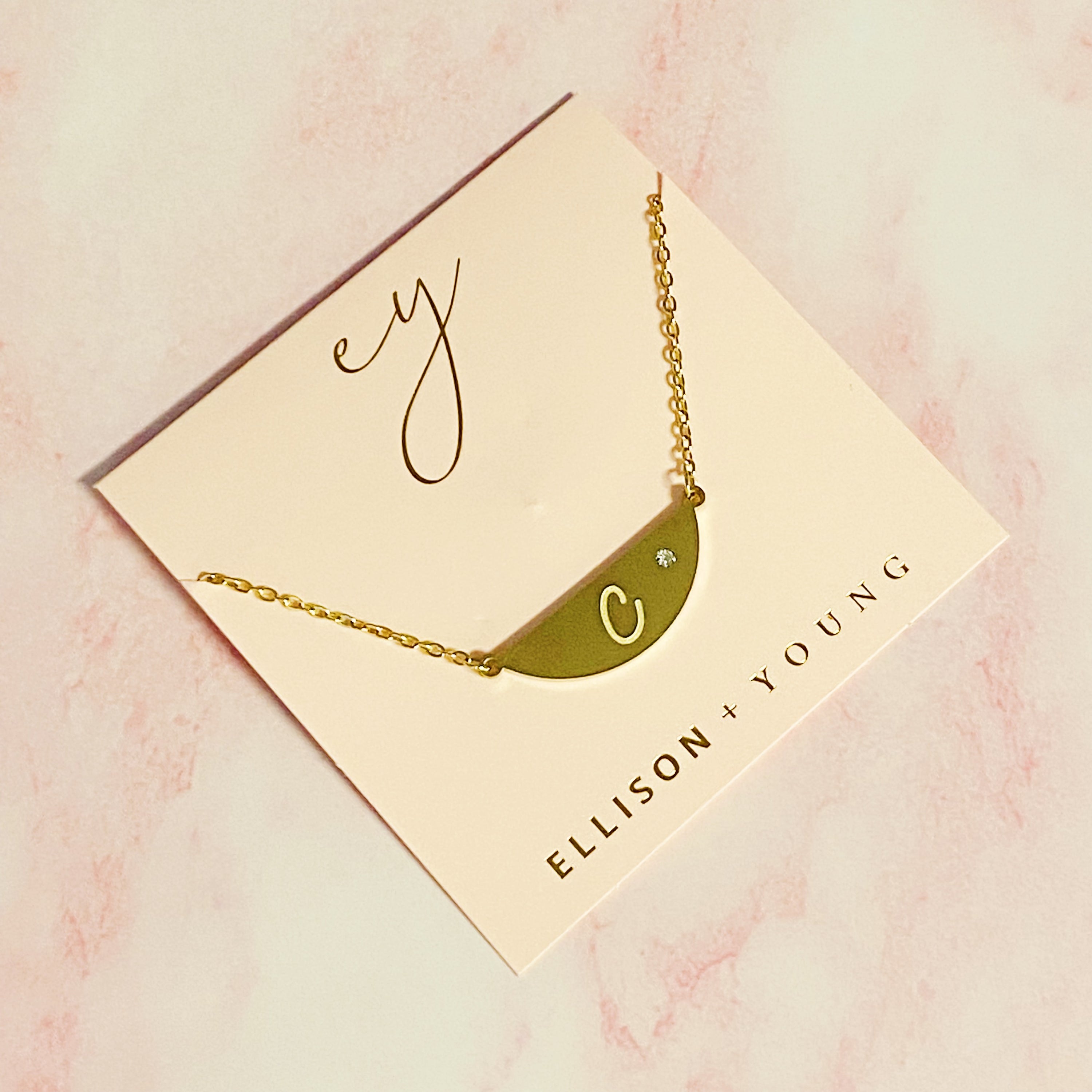 Hamilton Sphere Initial Necklace featuring a modern pendant design with an engraved initial and a brushed finish.