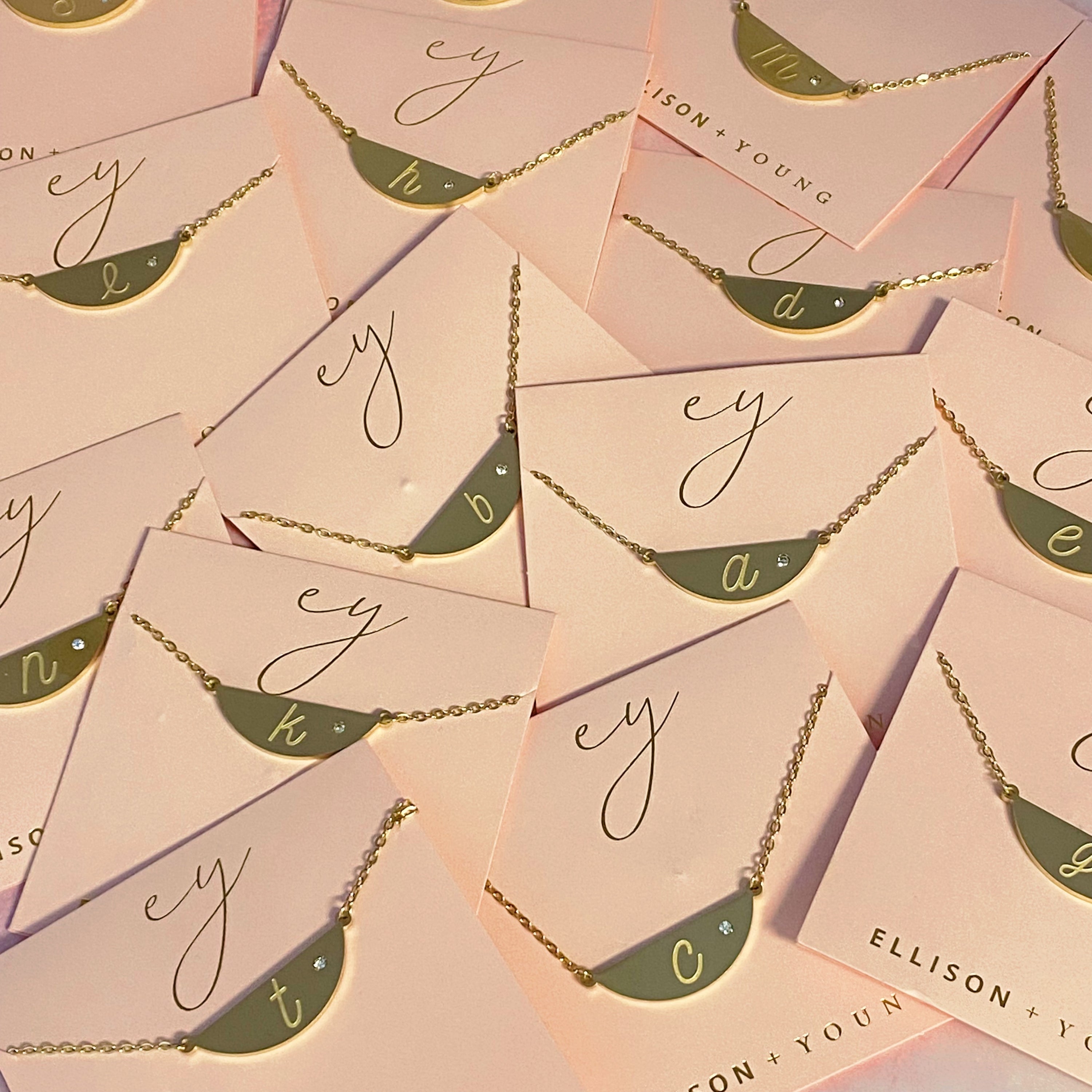 Hamilton Sphere Initial Necklace featuring a modern pendant design with an engraved initial and a brushed finish.