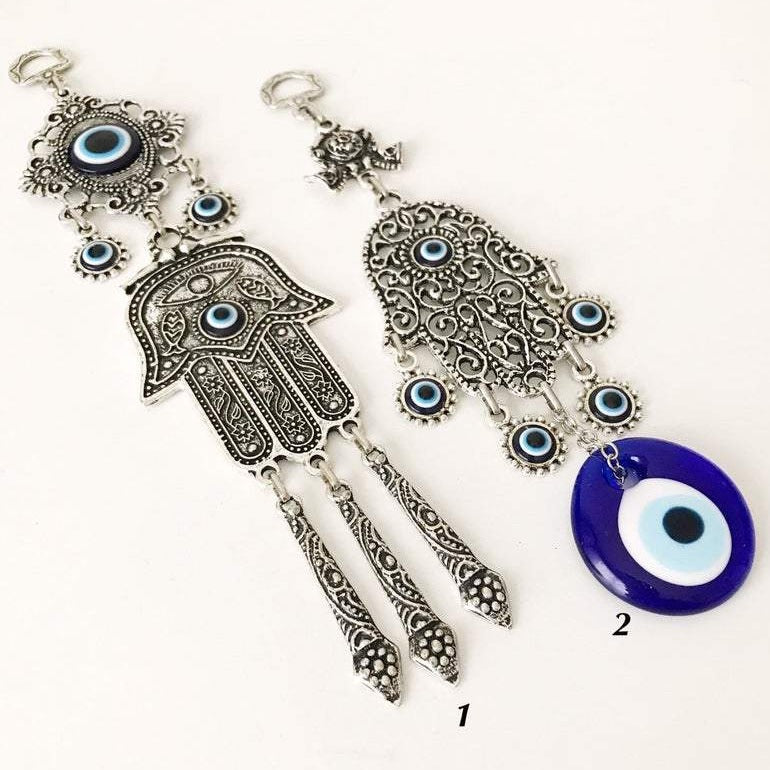 A beautifully crafted Hamsa wall art featuring an evil eye wall hanging, showcasing intricate designs and vibrant colors.