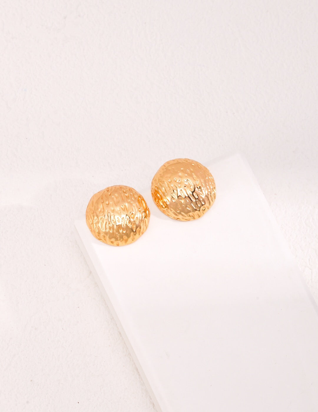 Hand-Carved Texture Round Stud earrings made of sterling silver and gold vermeil, showcasing a unique texture and elegant design.