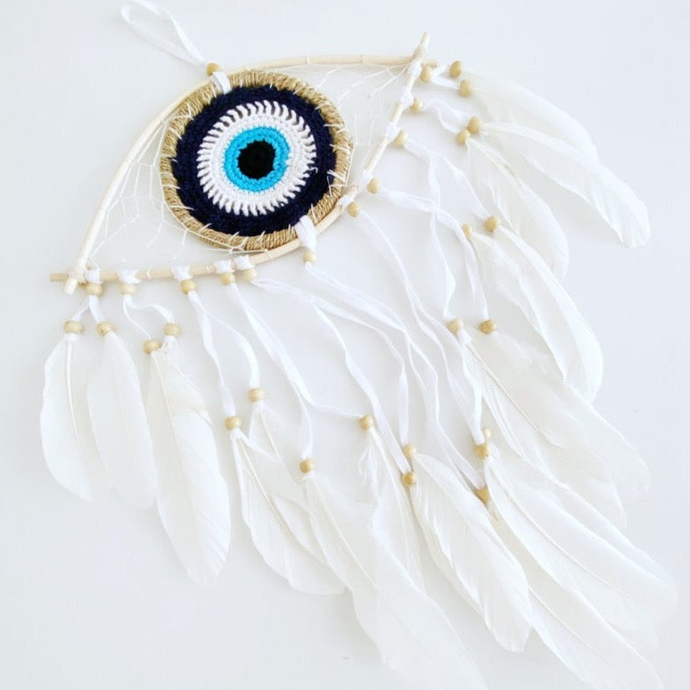 Handmade Evil Eye Dream Catcher featuring blue evil eye design, feathers, and bamboo frame, perfect for home decor and protection.
