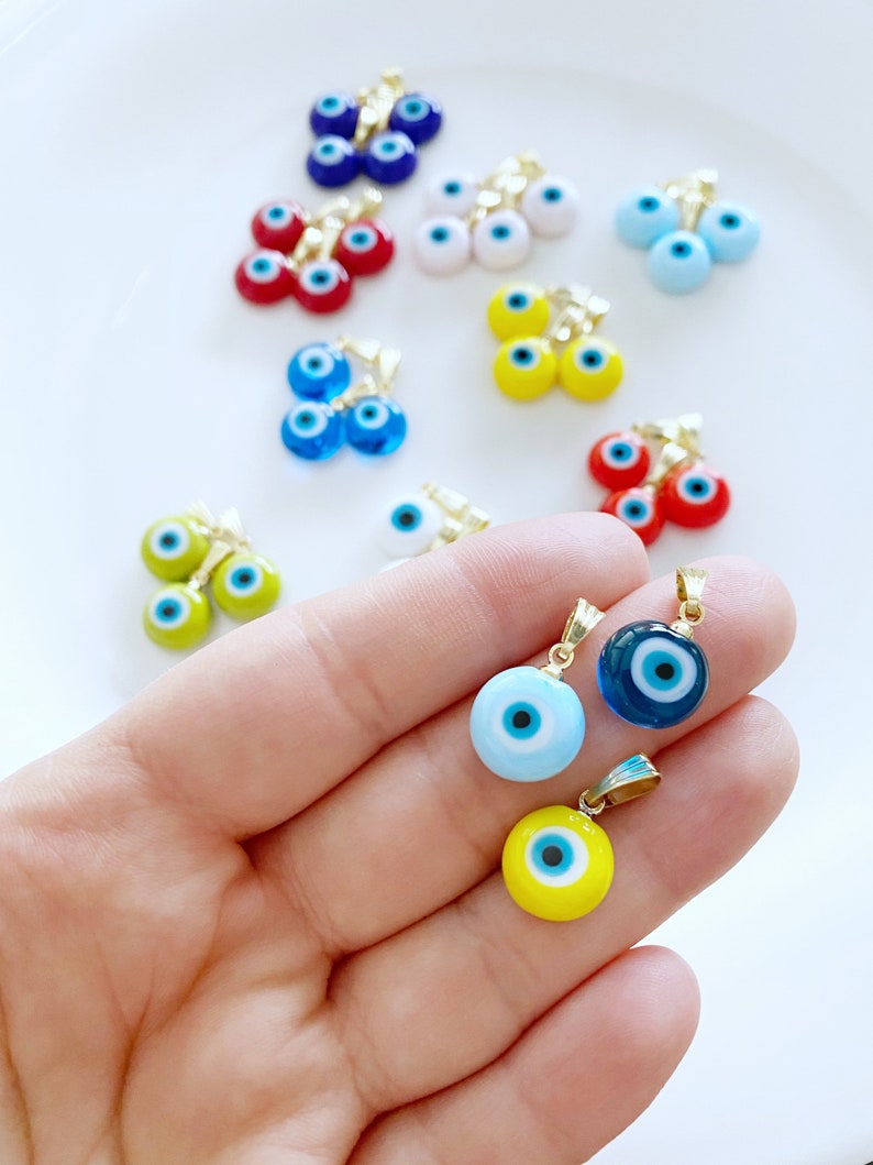Handmade Murano Evil Eye Necklace featuring a vibrant glass bead and a gold hook, symbolizing protection and good fortune.