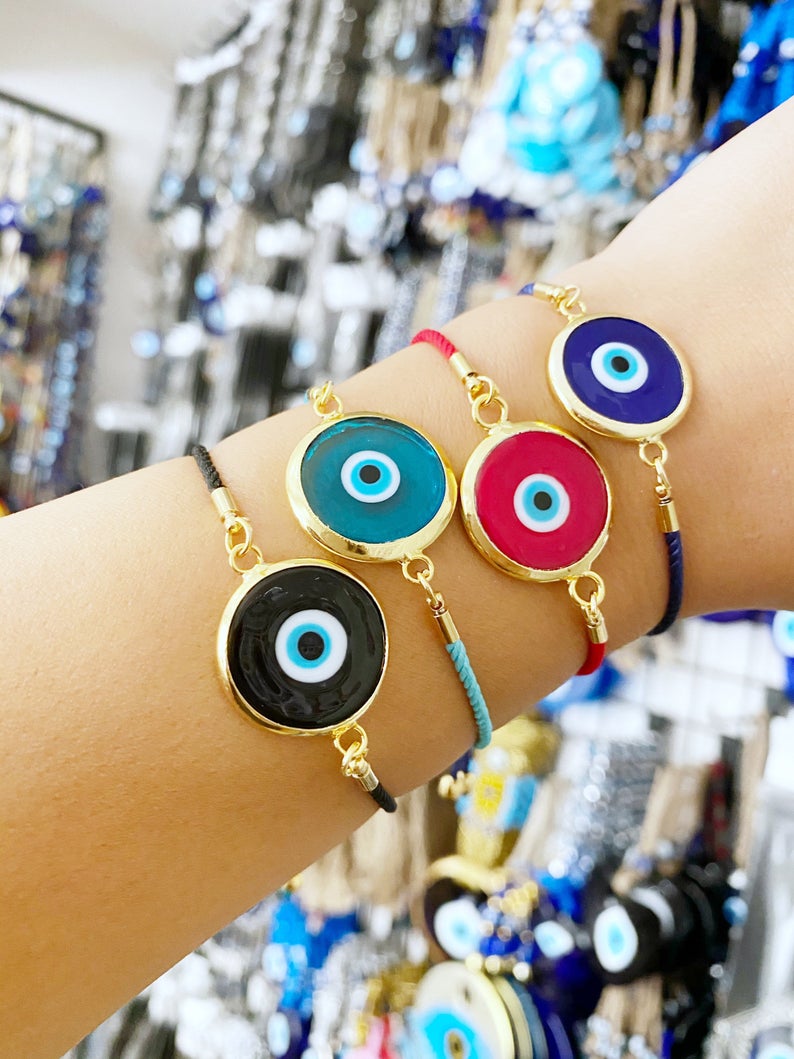 Handmade Murano Bracelet featuring colorful glass beads and adjustable cotton cord with an Evil Eye charm for protection.