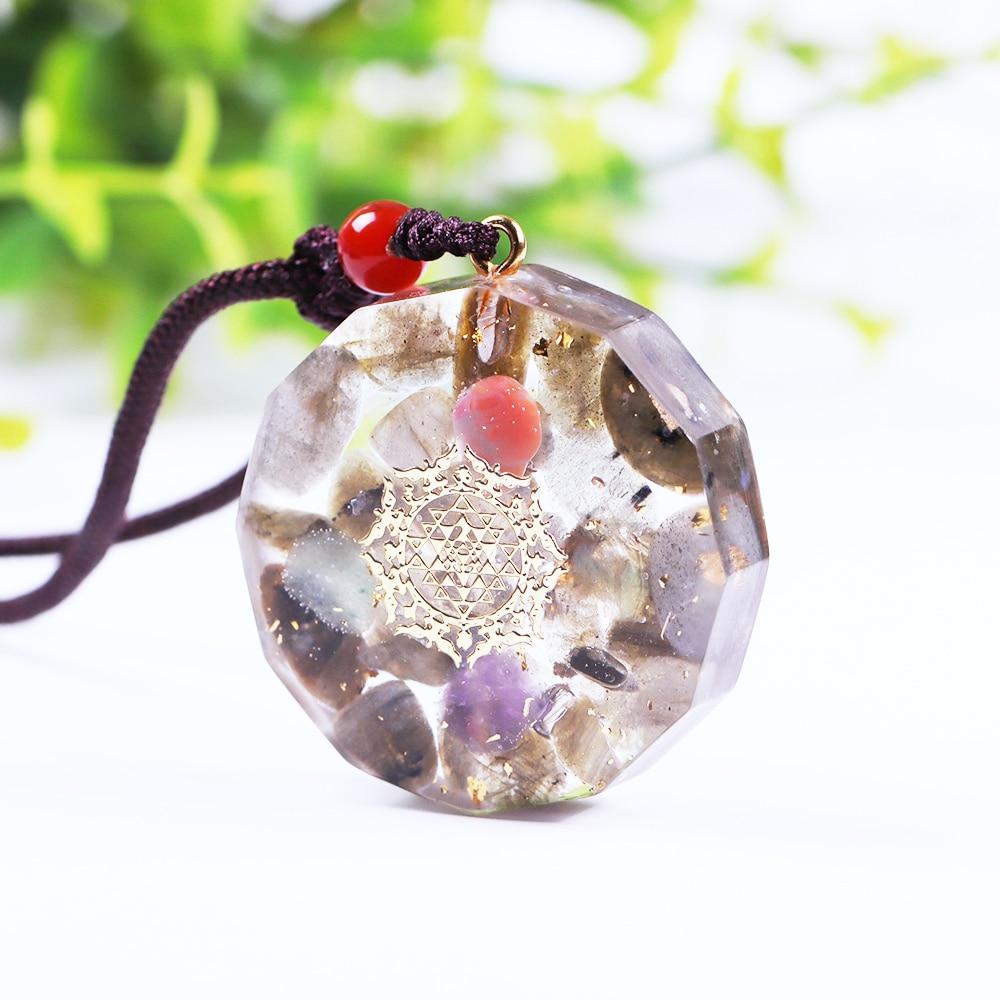 Handmade Orgone Pendant featuring Labradorite, amethyst, and green aventurine in a geometric design, perfect for EMF protection and Reiki healing.