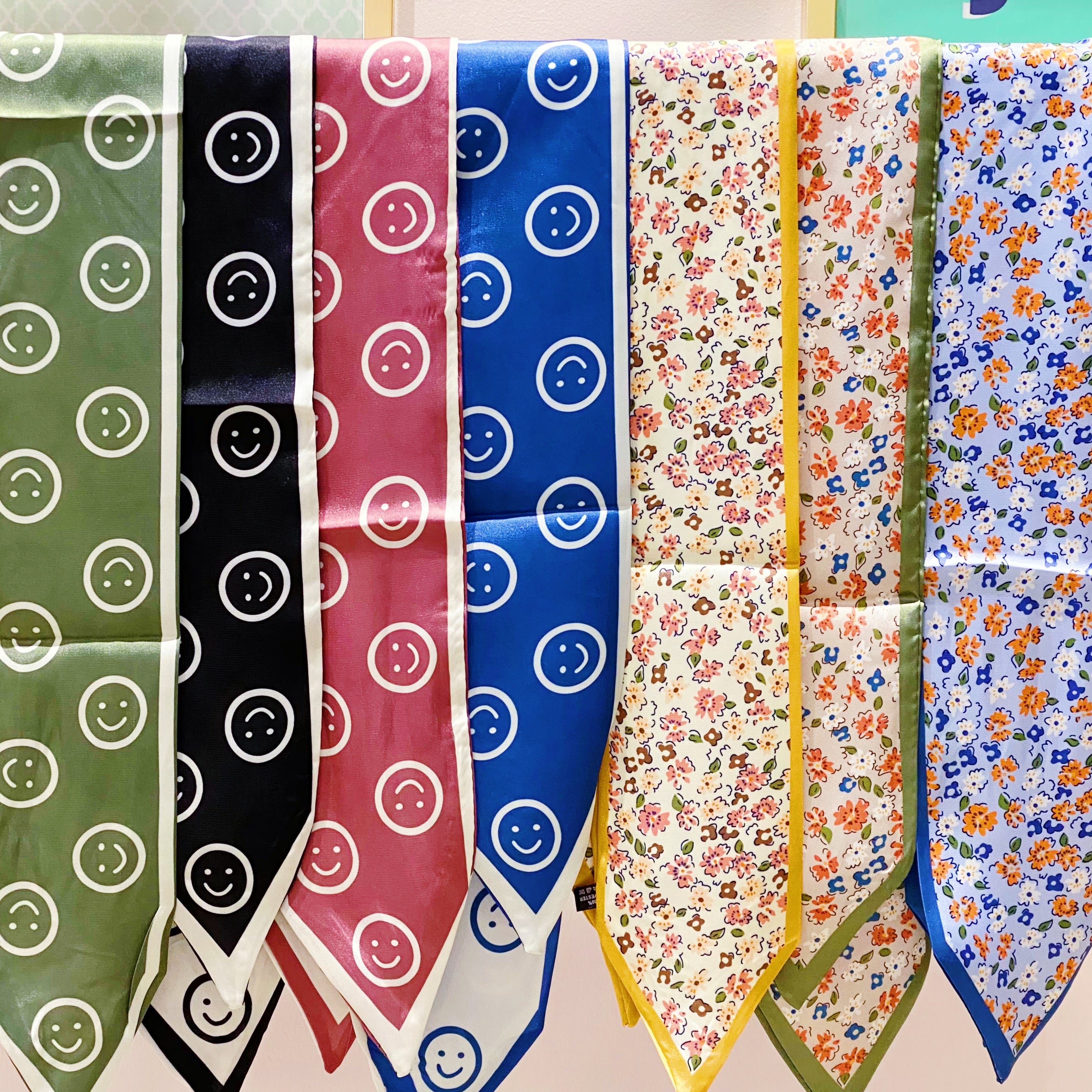 Happy All Around Sleek Scarf featuring cheerful happy faces, slim design, and vibrant colors, perfect for versatile styling.