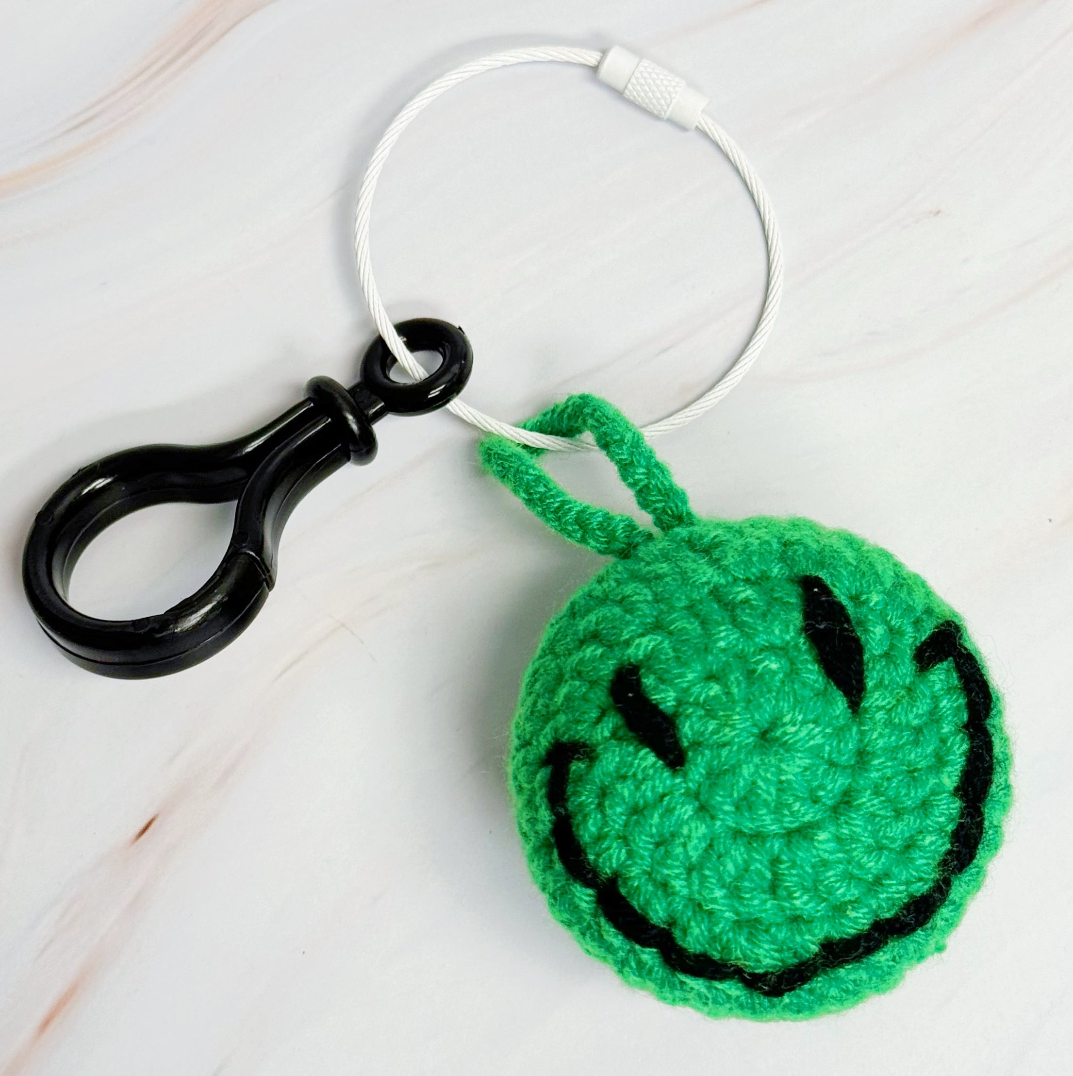Happy Face Puffy Ball Key Ring with colorful knitted design and secure locking mechanism, perfect for keys and bags.