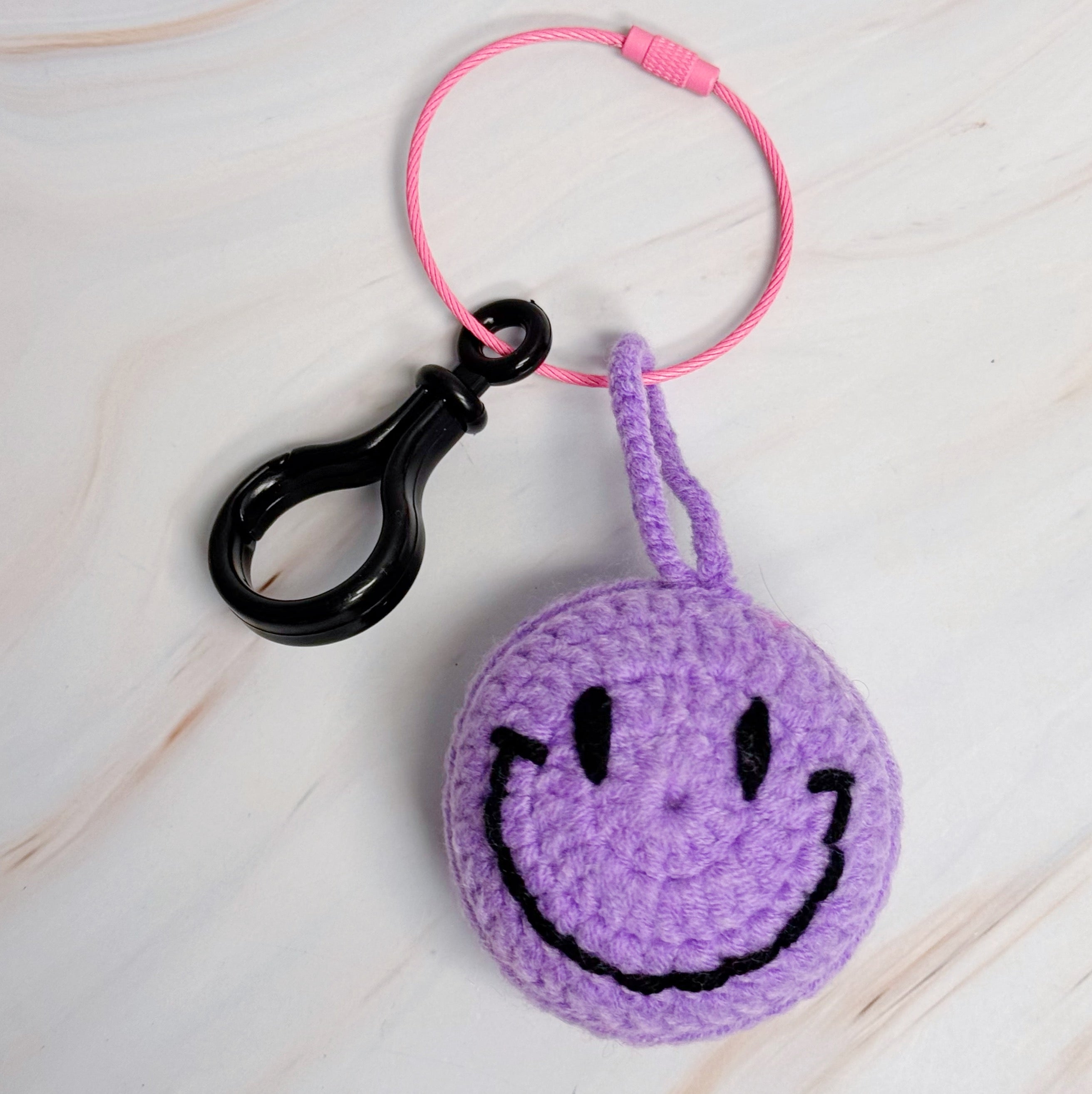 Happy Face Puffy Ball Key Ring with colorful knitted design and secure locking mechanism, perfect for keys and bags.