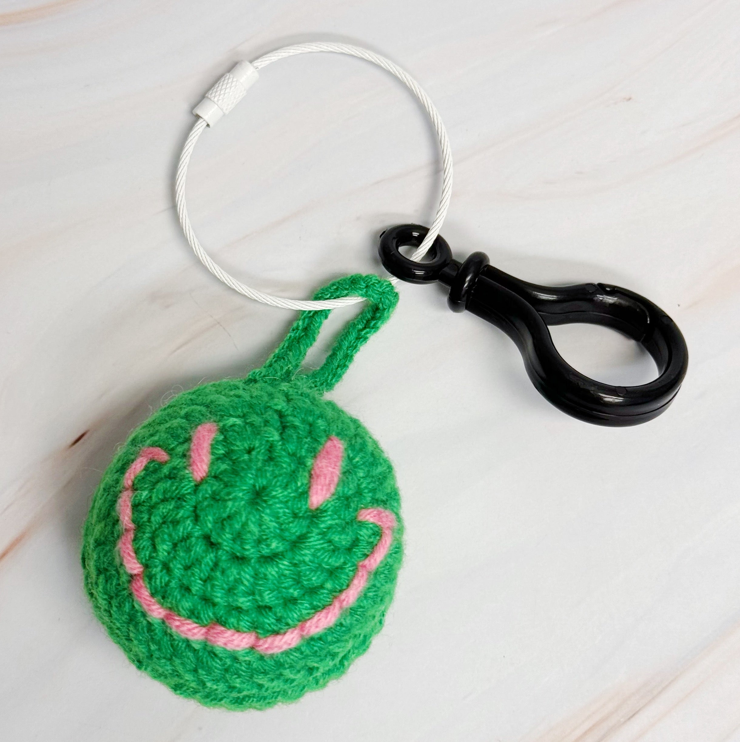 Happy Face Puffy Ball Key Ring with colorful knitted design and secure locking mechanism, perfect for keys and bags.