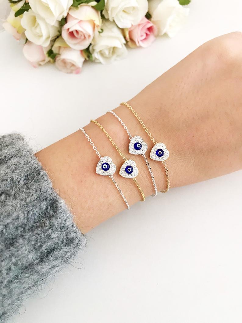 Heart Evil Eye Bracelet featuring a gold or silver chain with a protective charm, handmade with zircon stones.