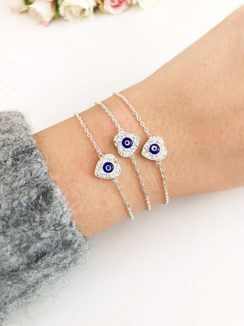 Heart Evil Eye Bracelet featuring a gold or silver chain with a protective charm, handmade with zircon stones.