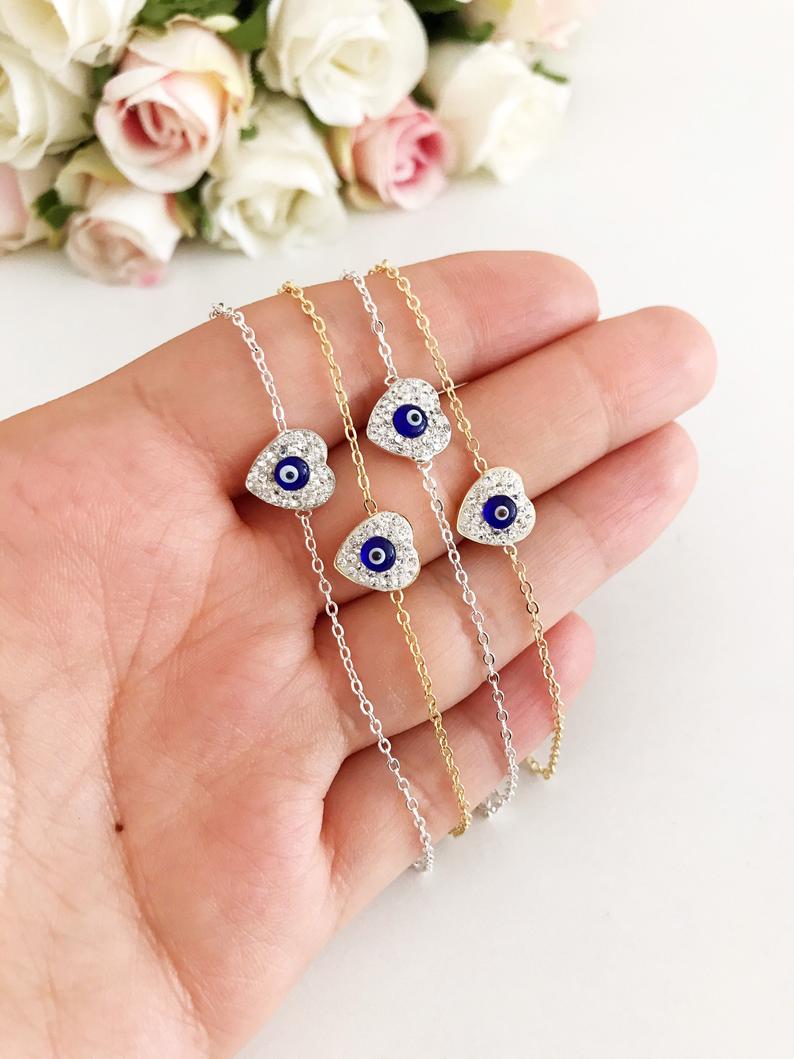 Heart Evil Eye Bracelet featuring a gold or silver chain with a protective charm, handmade with zircon stones.