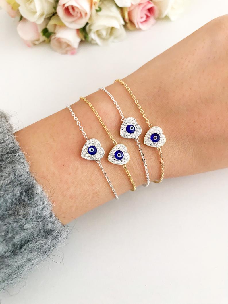 Heart Evil Eye Bracelet featuring a gold or silver chain with a protective charm, handmade with zircon stones.