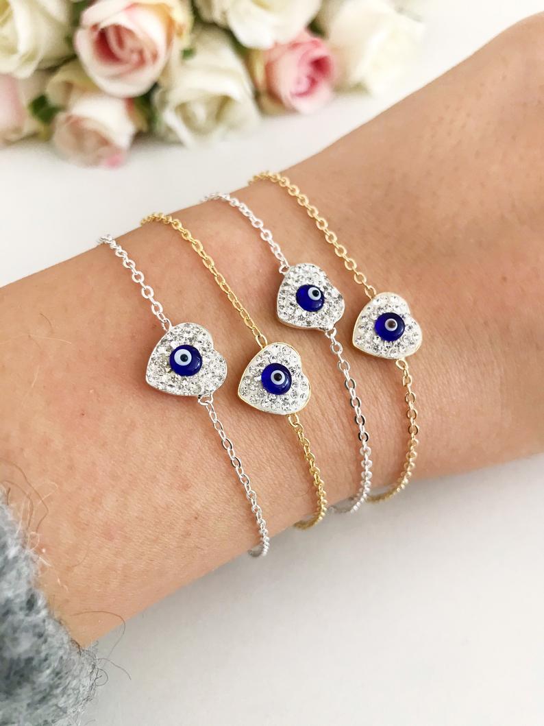 Heart Evil Eye Bracelet featuring a gold or silver chain with a protective charm, handmade with zircon stones.