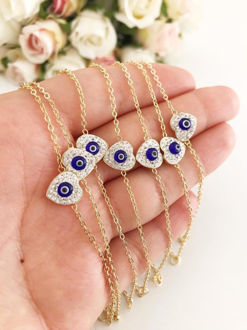 Heart Evil Eye Bracelet featuring a gold or silver chain with a protective charm, handmade with zircon stones.