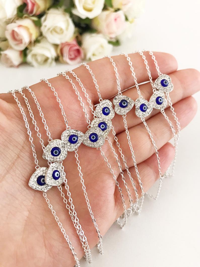 Heart Evil Eye Bracelet featuring a gold or silver chain with a protective charm, handmade with zircon stones.
