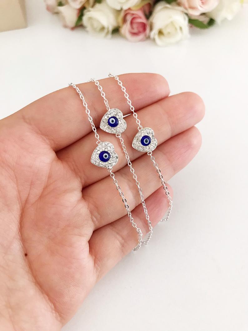 Heart Evil Eye Bracelet featuring a gold or silver chain with a protective charm, handmade with zircon stones.