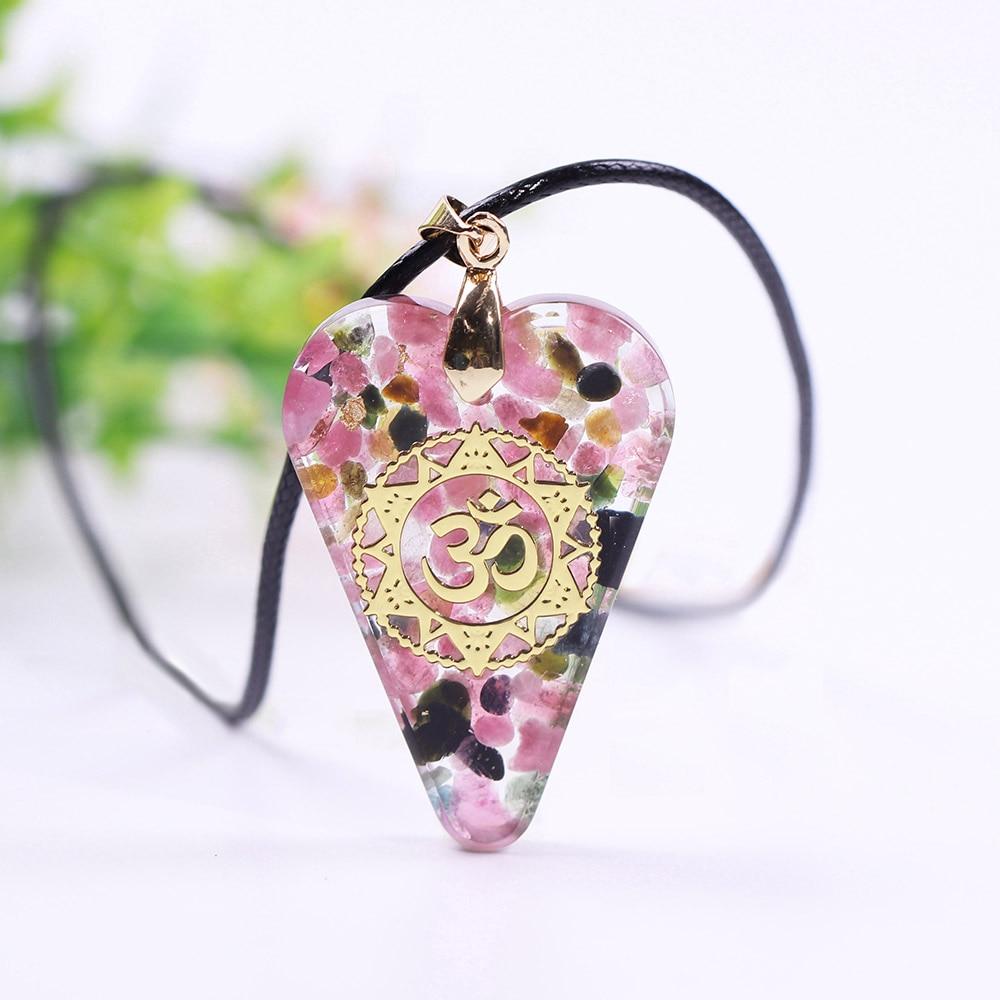 Heart Handmade Orgone Pendant featuring tourmaline crystal and copper, showcasing a geometric design on a rope chain.