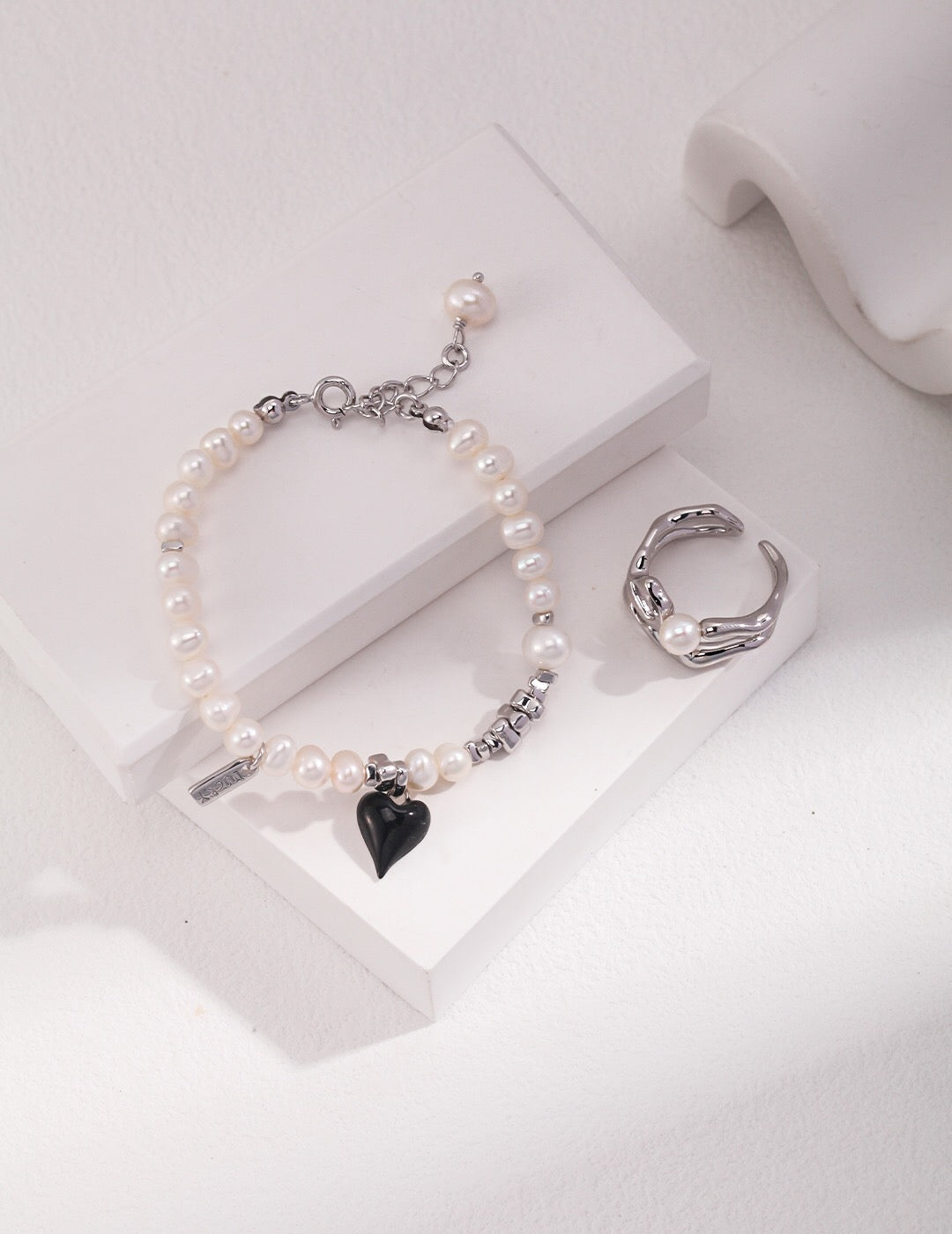 Elegant Heart Pendant Pearl Bracelet featuring natural pearls and sterling silver, perfect for any occasion.