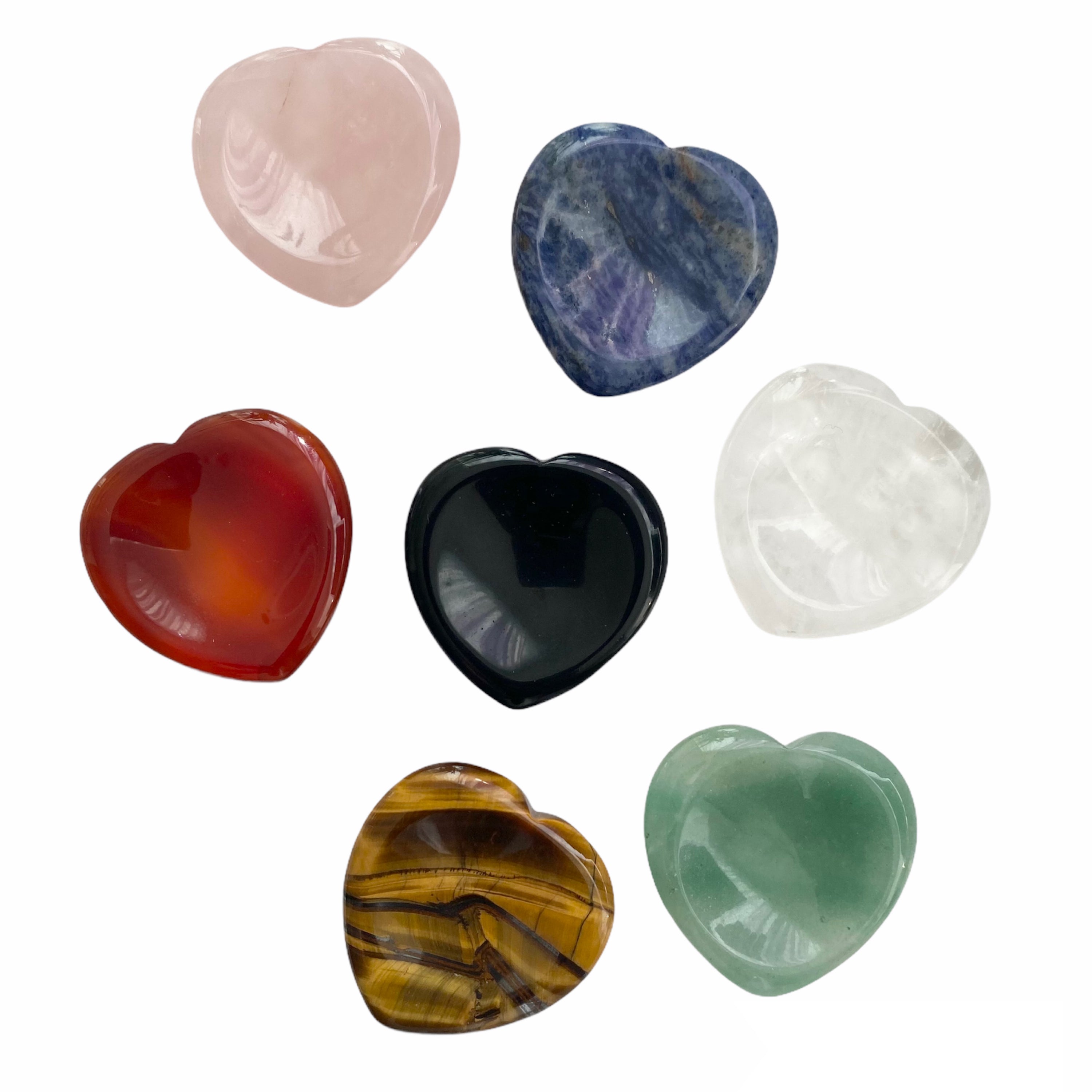 A collection of heart shaped worry stones in various colors and textures, symbolizing calmness and healing.