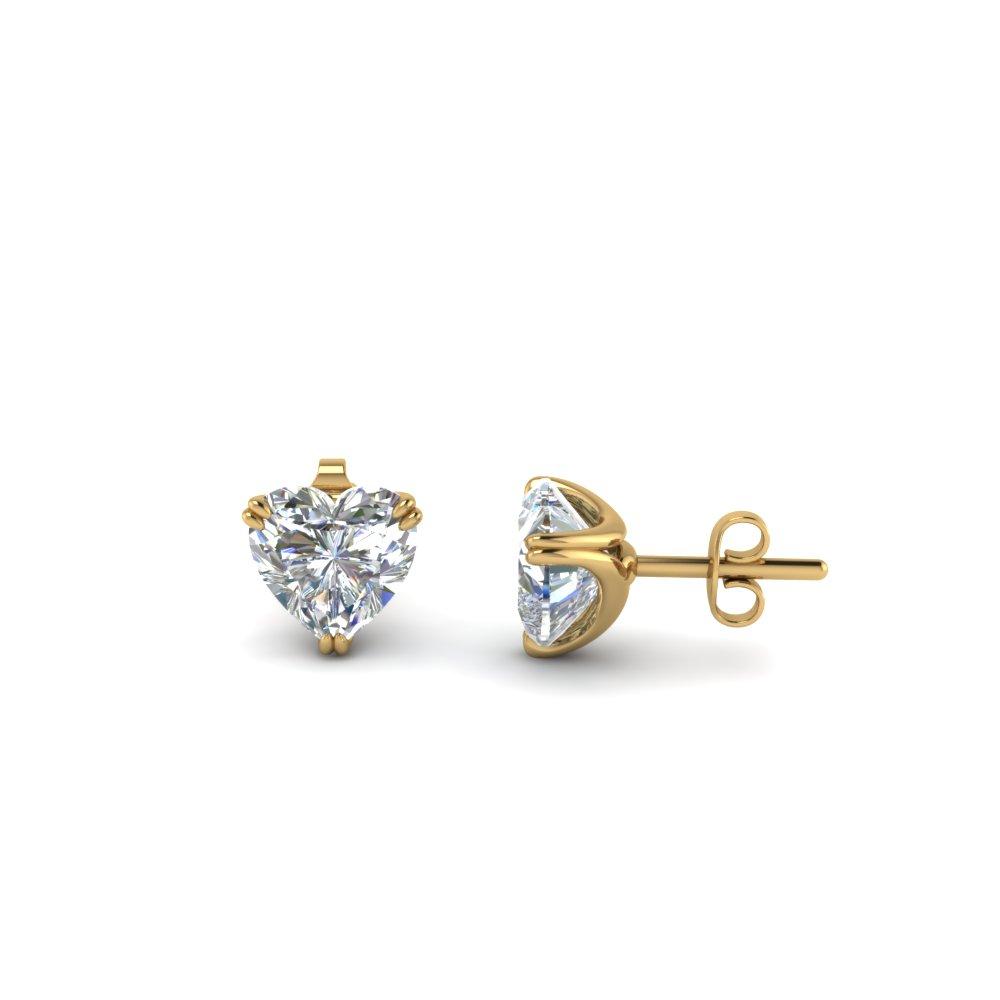 A pair of heart-shaped stud earrings made with elements in sterling silver plated, showcasing their sparkling design and secure prong setting.