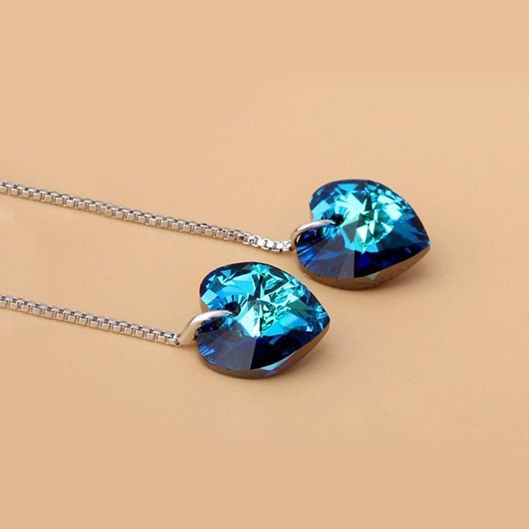 Elegant Heart Threader Drop earrings in 18K white gold plating, featuring a unique heart design and hypoallergenic crystals.