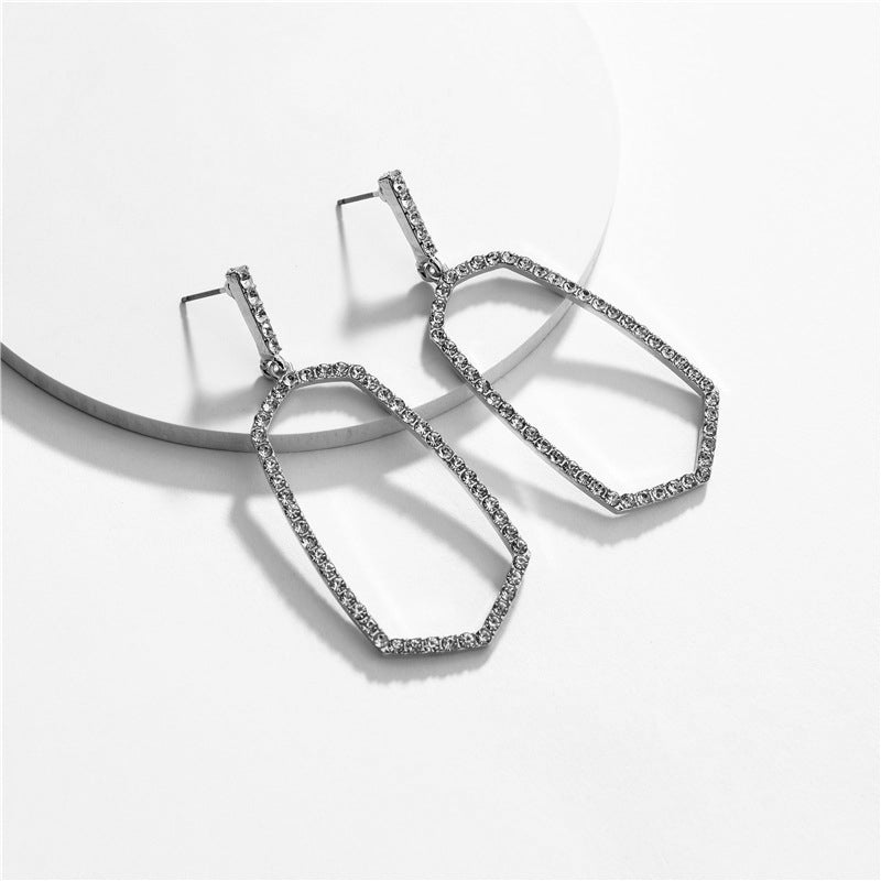 Hexagon Stone Ring Post Earrings by DOBBI in various colors, showcasing a modern geometric design with a stone accent.