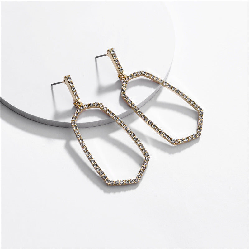 Hexagon Stone Ring Post Earrings by DOBBI in various colors, showcasing a modern geometric design with a stone accent.