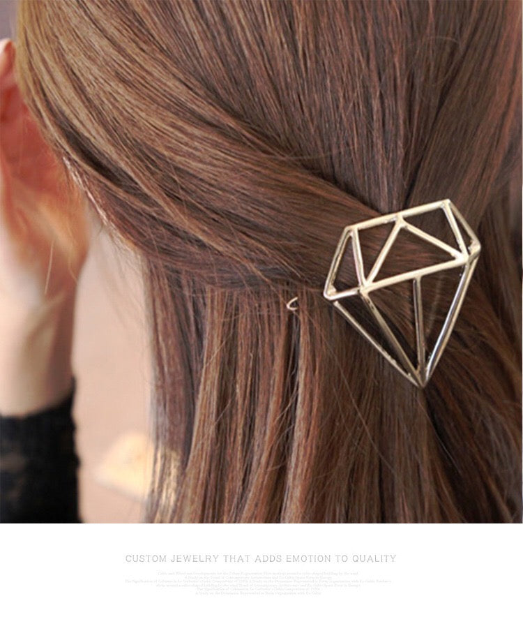 A pair of hollow diamond-shaped hair clips made from alloy, showcasing an elegant design suitable for various hairstyles.