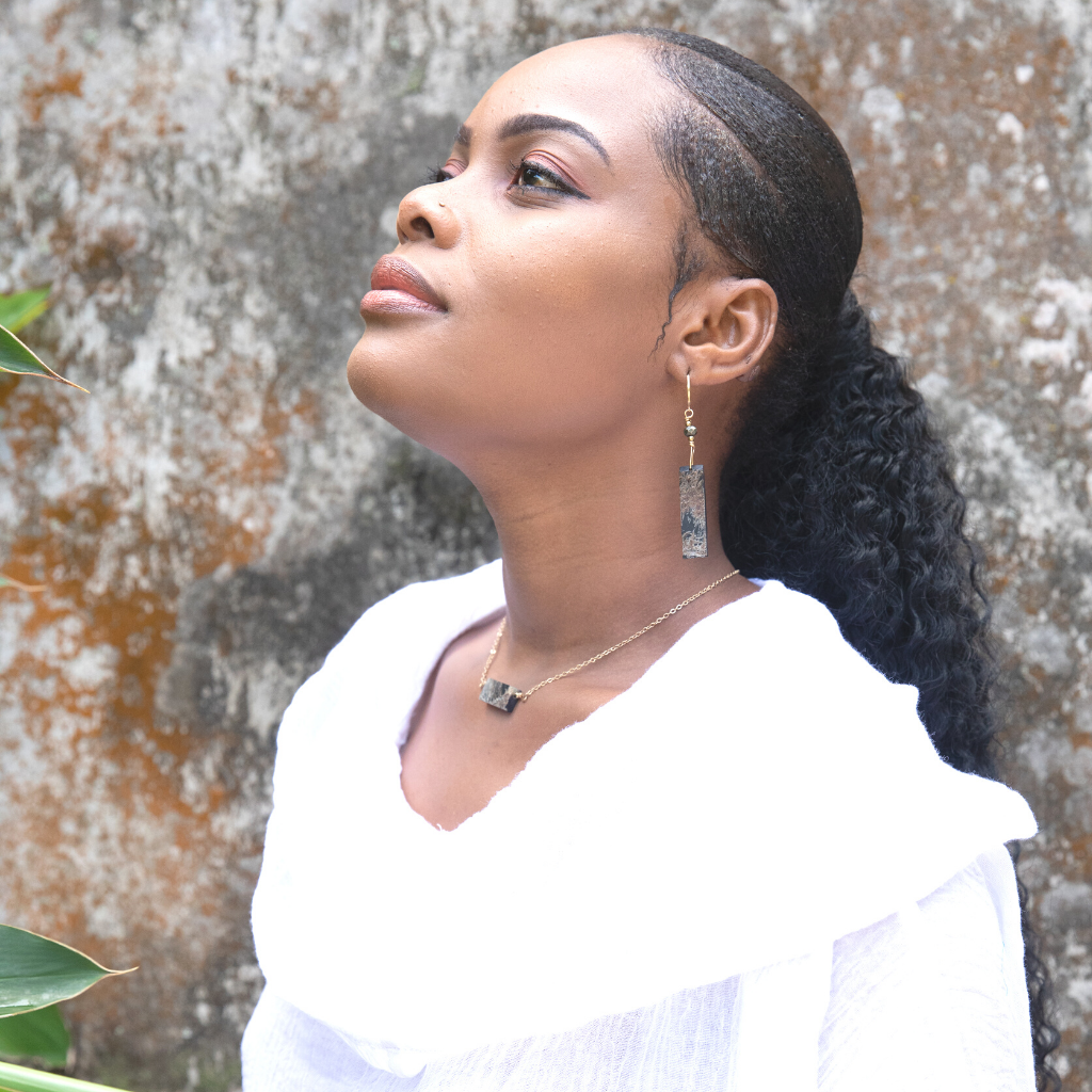 Elegant Horn Pendant Choker featuring polished horn and hand-wrapped pyrite gemstones, showcasing a unique and adjustable design.