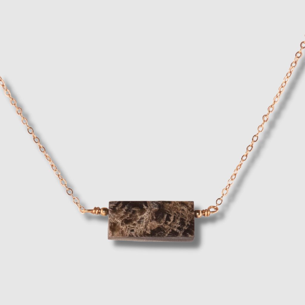Elegant Horn Pendant Choker featuring polished horn and hand-wrapped pyrite gemstones, showcasing a unique and adjustable design.