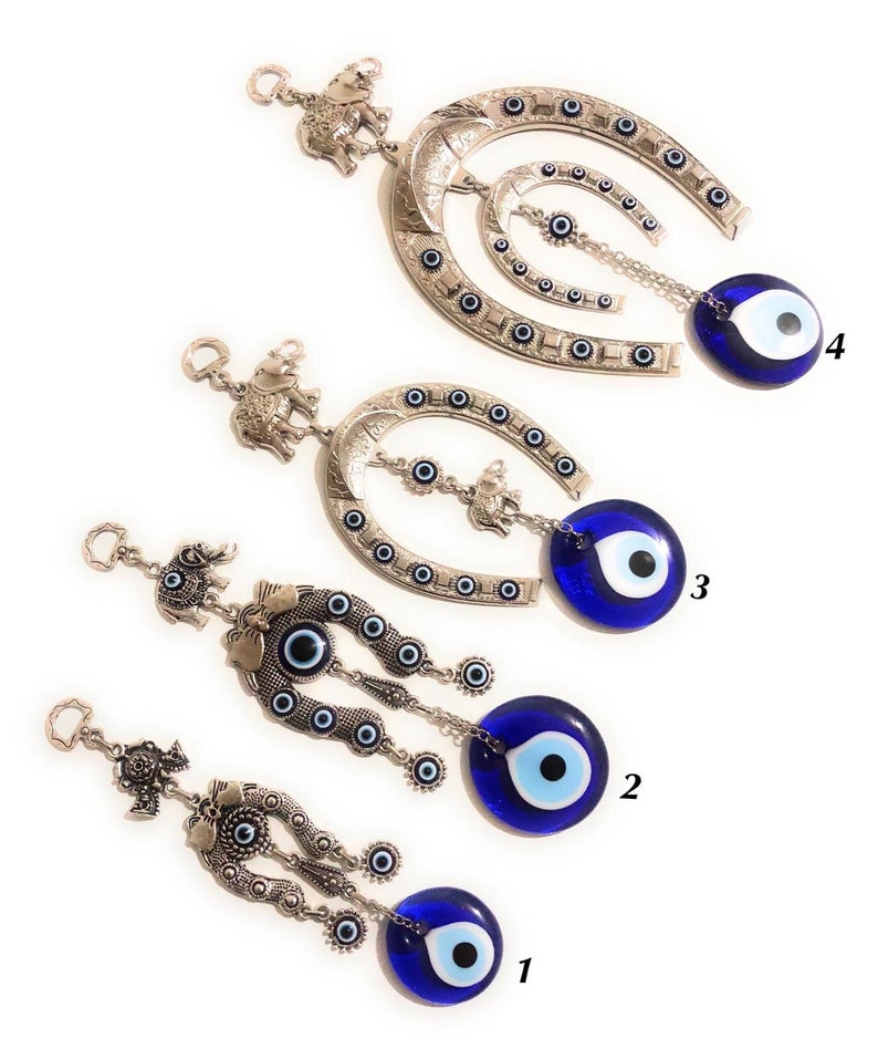 A beautifully crafted Horseshoe evil eye wall hanging featuring vibrant colors and intricate designs, symbolizing good luck and protection.